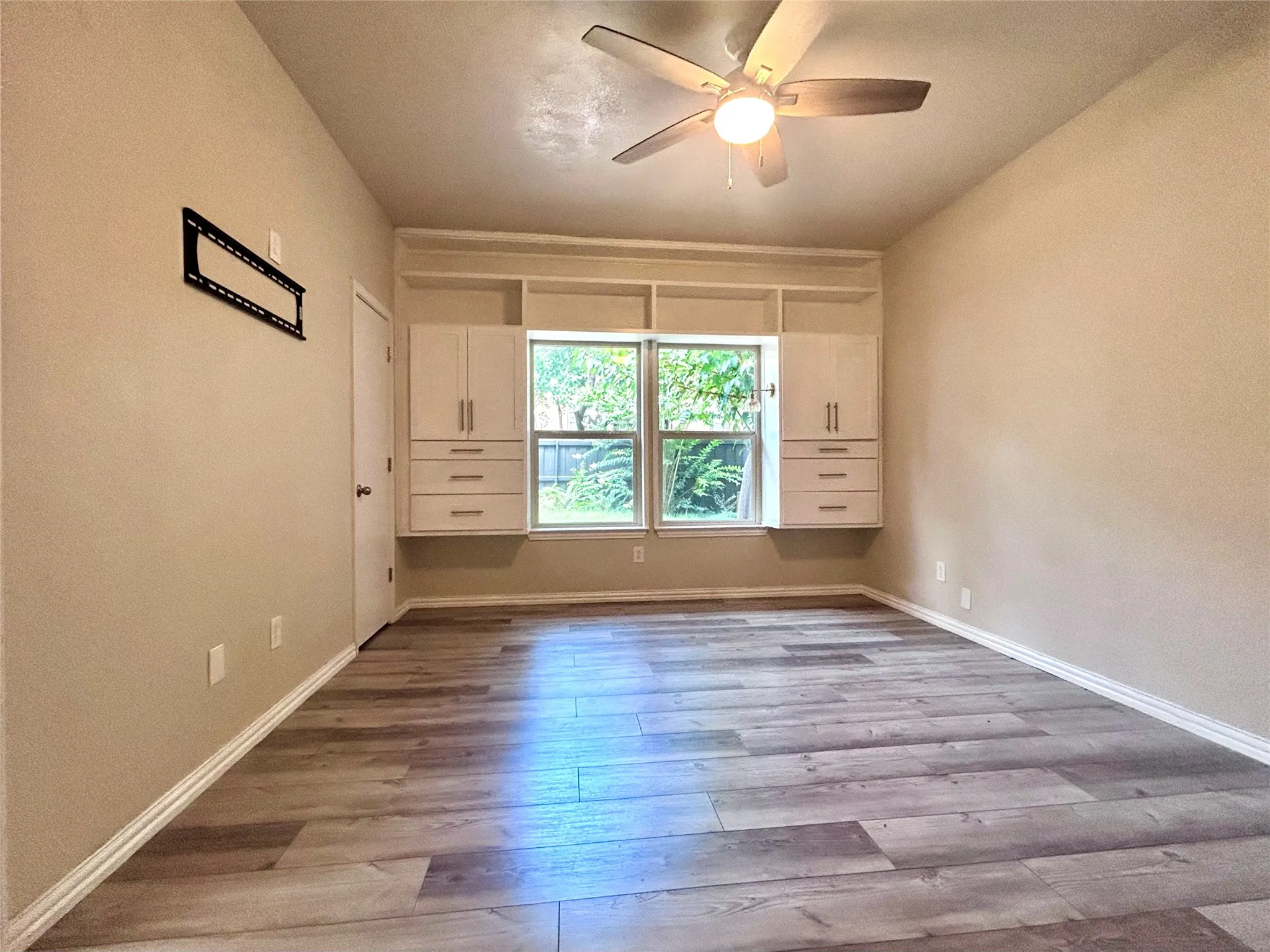 This view of the bedroom shows the built in storage and a private view!