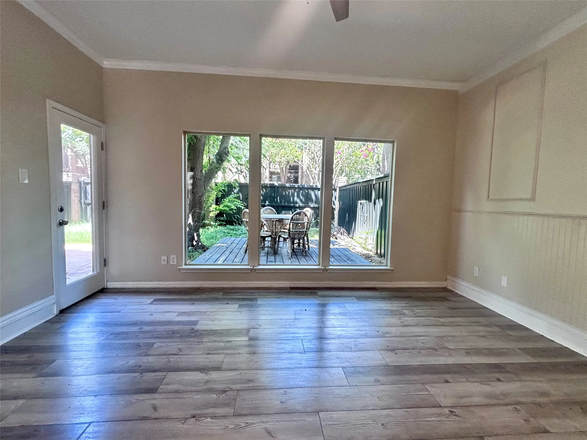 Enjoy the view!  The family room has lots of natural light and access to a private back yard!