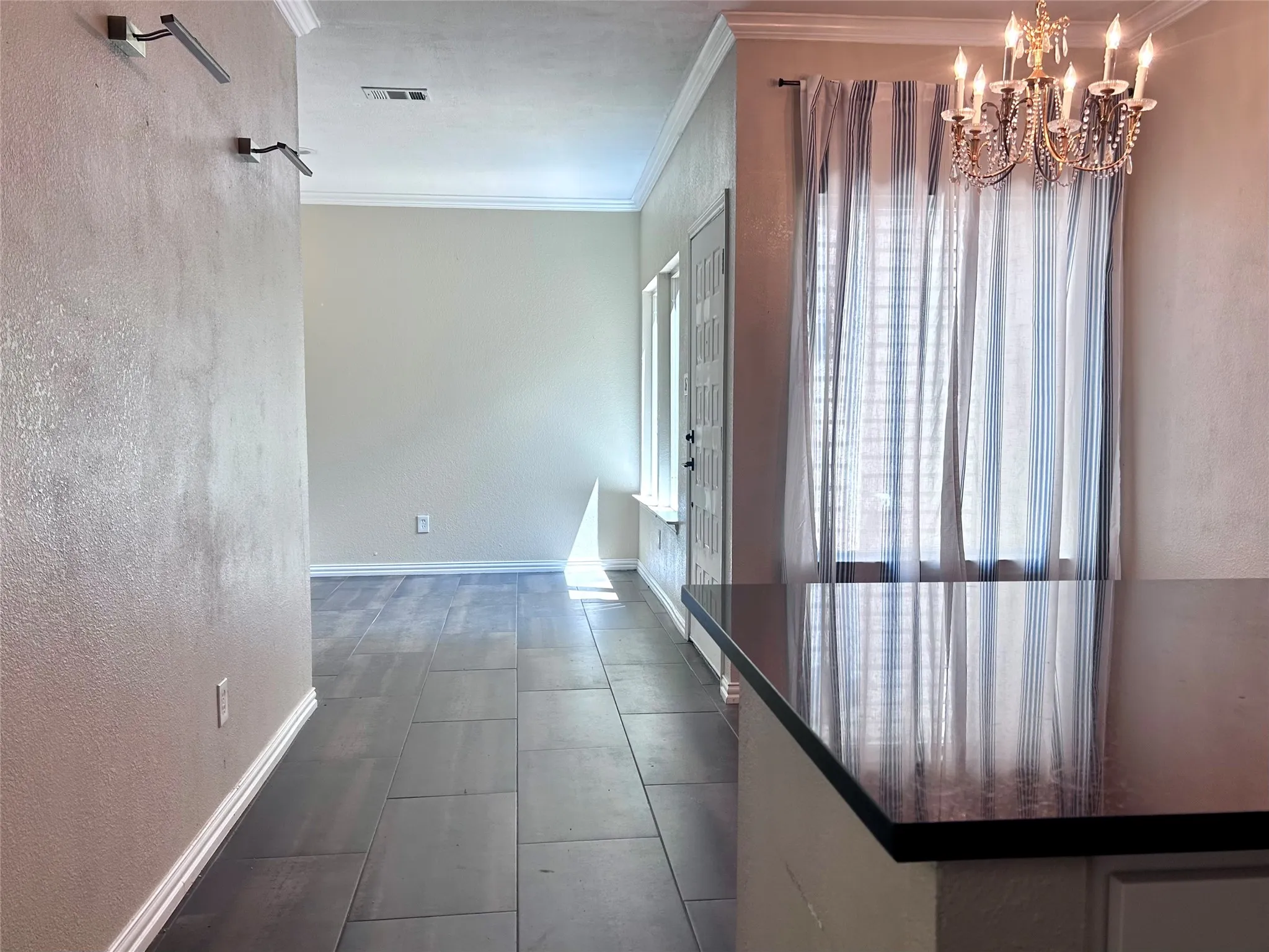 This view shows the dining area and flex space - foyer.
