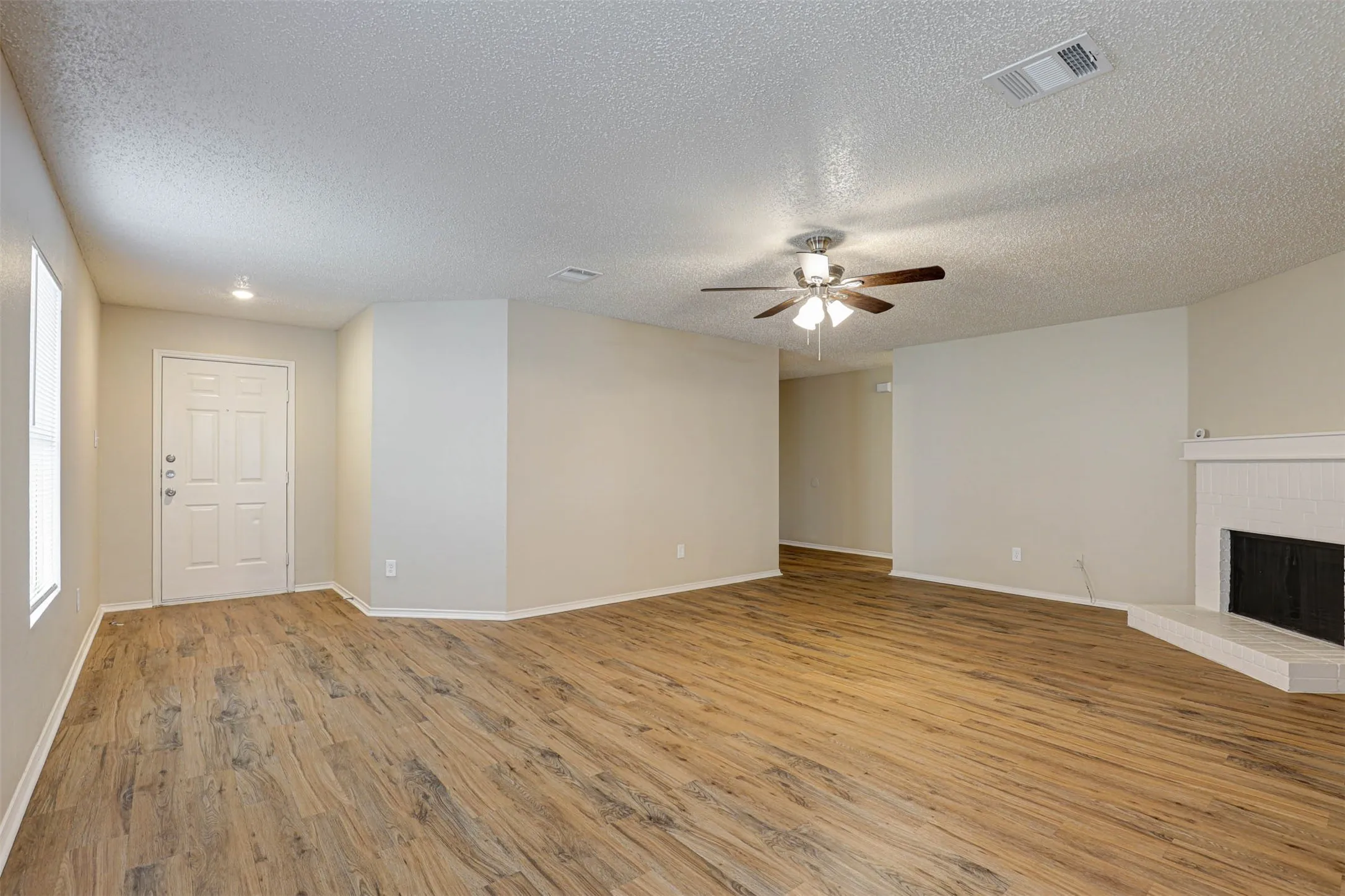 Large open family room with lots of room for decorating to your taste