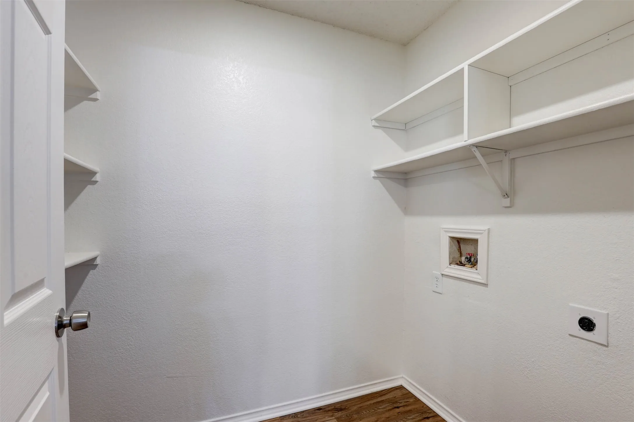 Storage shelves on both sides of the utility room