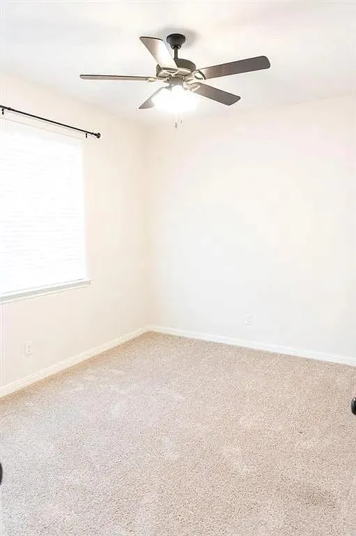 Neutral wall tones with light beige carpeting