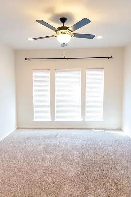 Neutral tone carpeting throughout