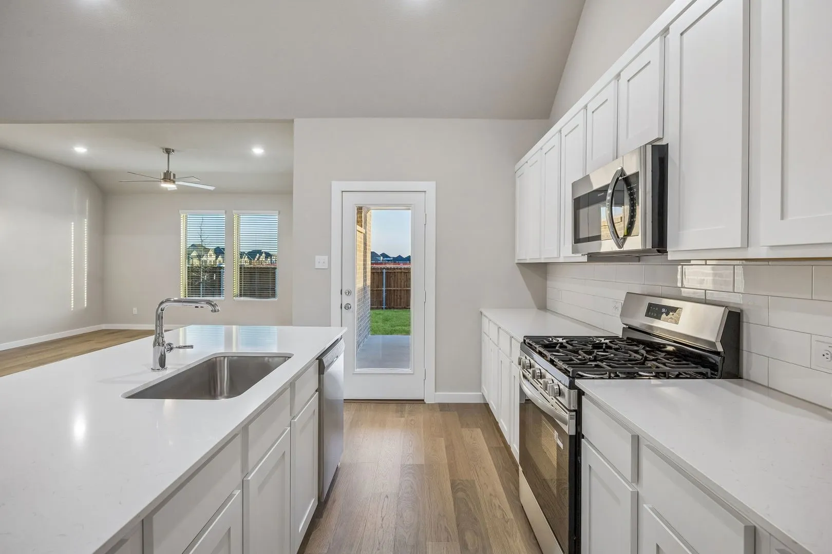 Kitchen in the Wimbledon home plan by Trophy Signature Homes – REPRESENTATIVE PHOTO