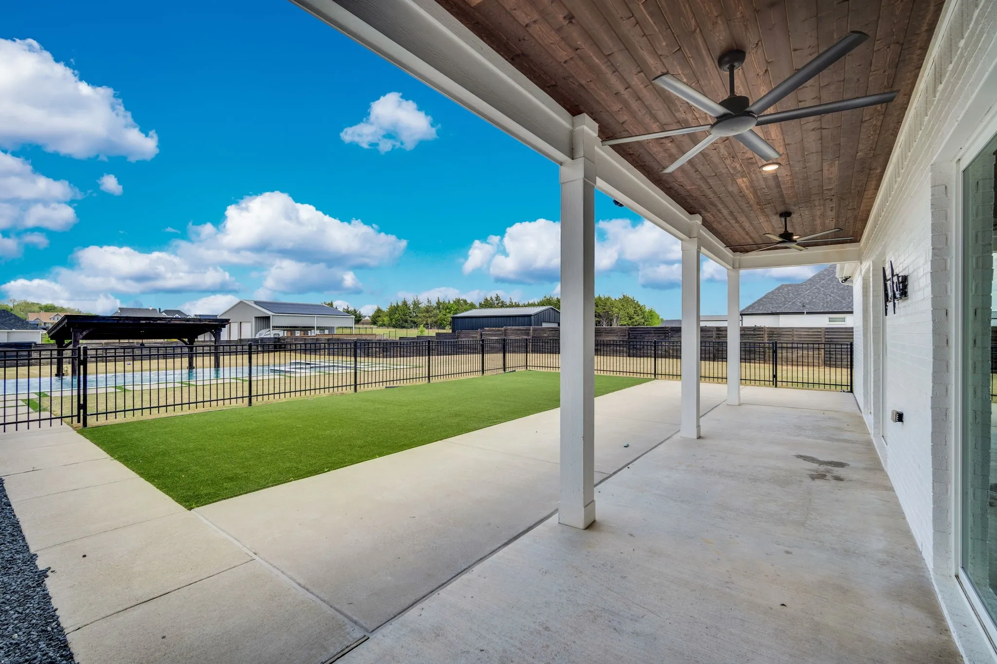Covered patio leads to pool