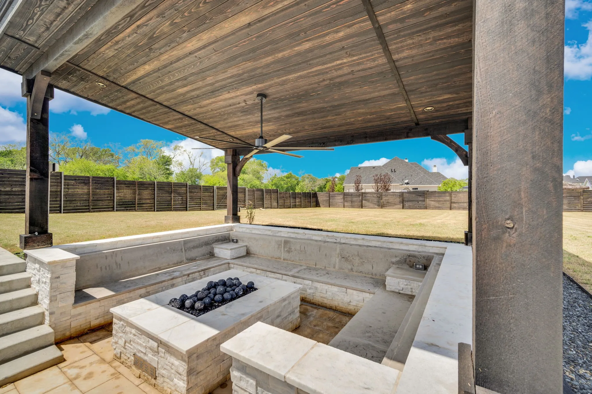 Covered gathering area with firepit