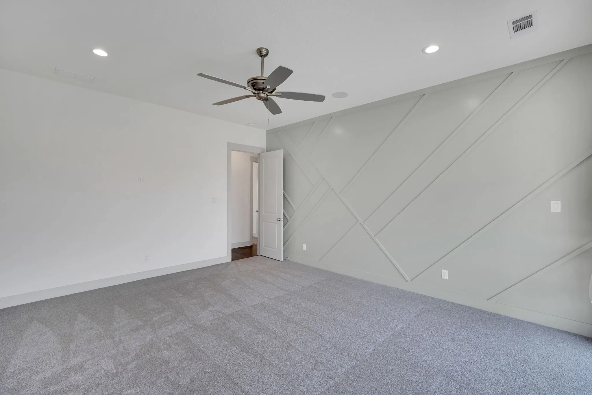 Custom wall treatment in primary bedroom