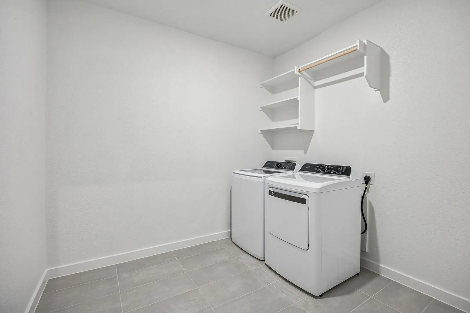Utility Room in the Wimbledon home plan by Trophy Signature Homes – REPRESENTATIVE PHOTO