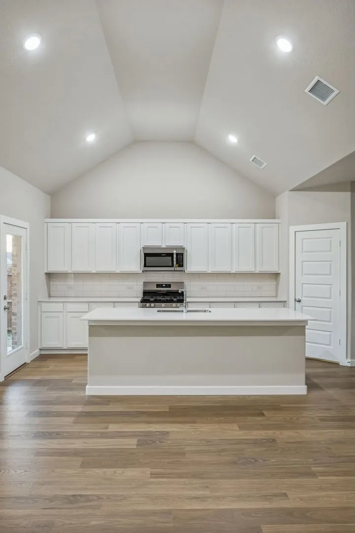Kitchen in the Wimbledon home plan by Trophy Signature Homes – REPRESENTATIVE PHOTO