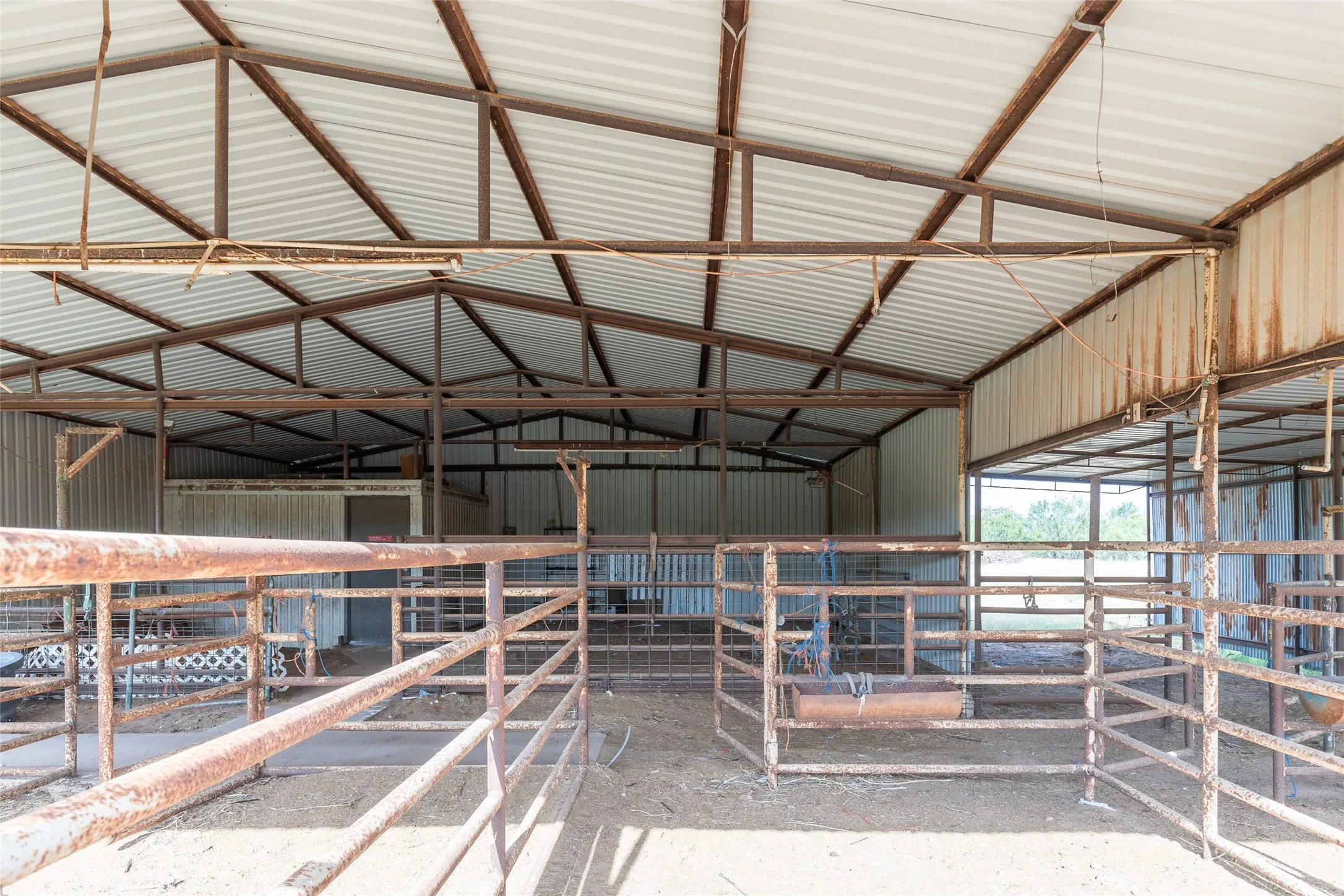 Expansive metal-framed structure with a corrugated roof