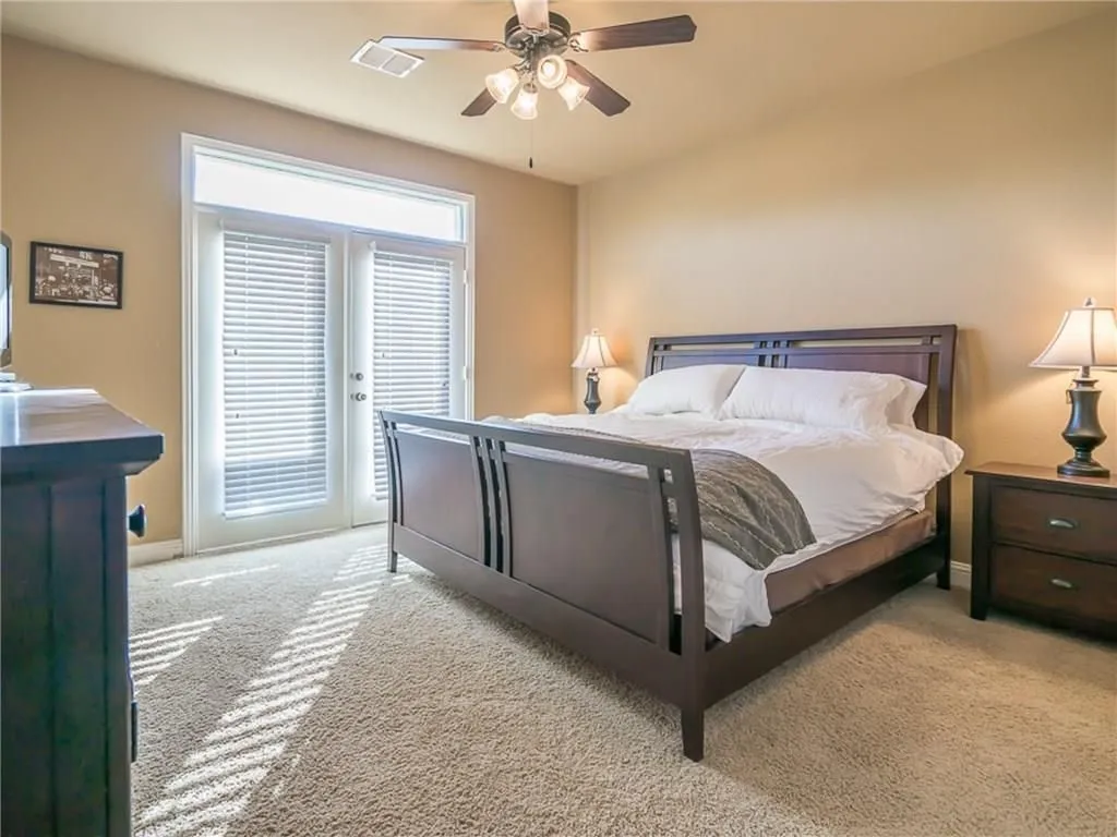 Soft-toned walls complement plush carpet flooring