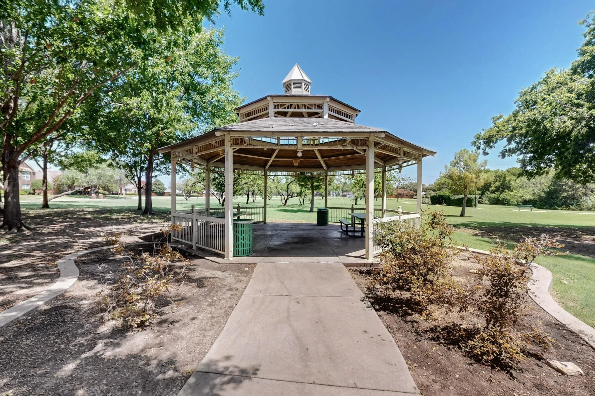 Octagonal gazebo with a tiered roof and decorative cupola