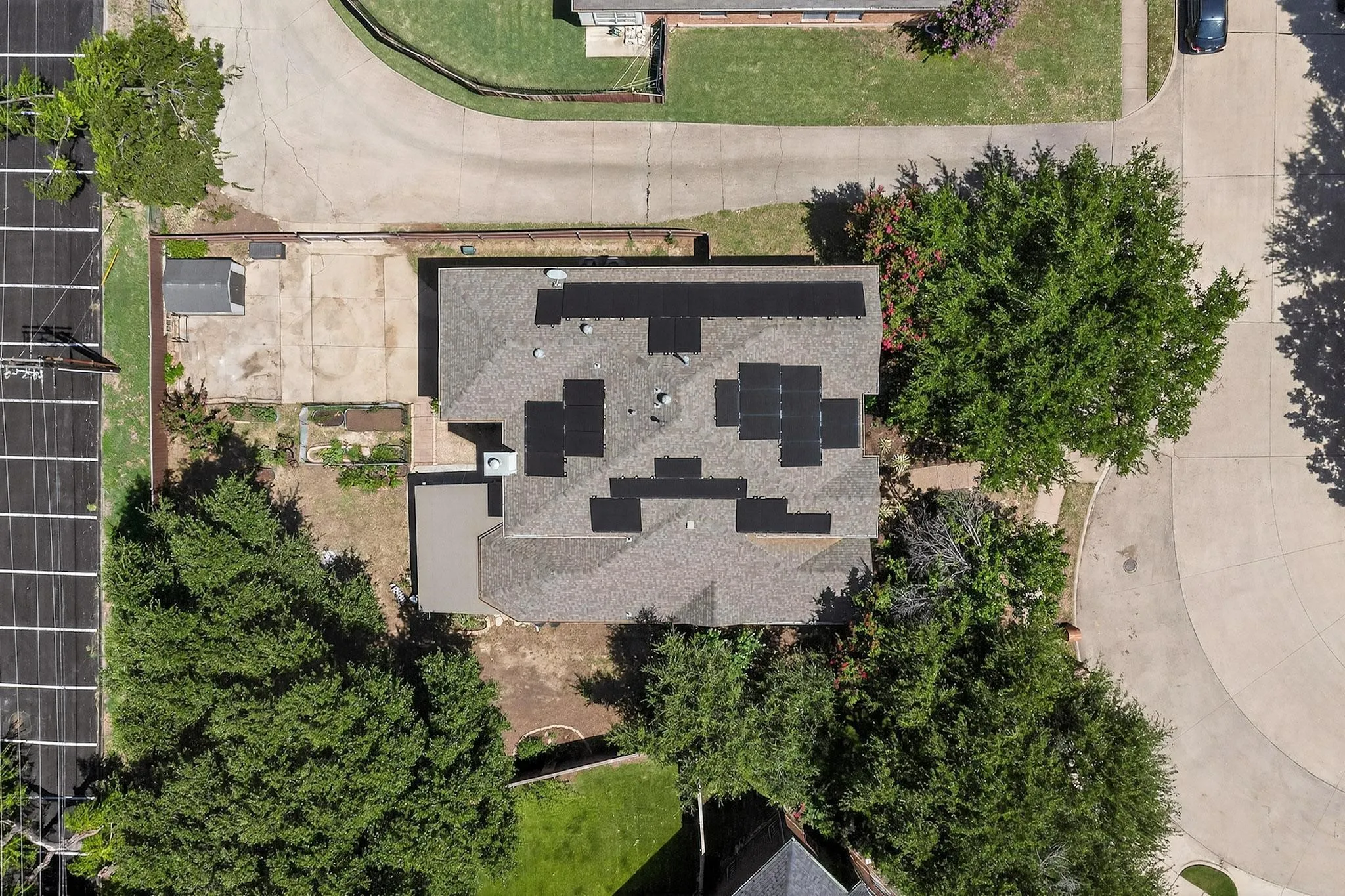 Shingled roofing with multiple solar panel installations