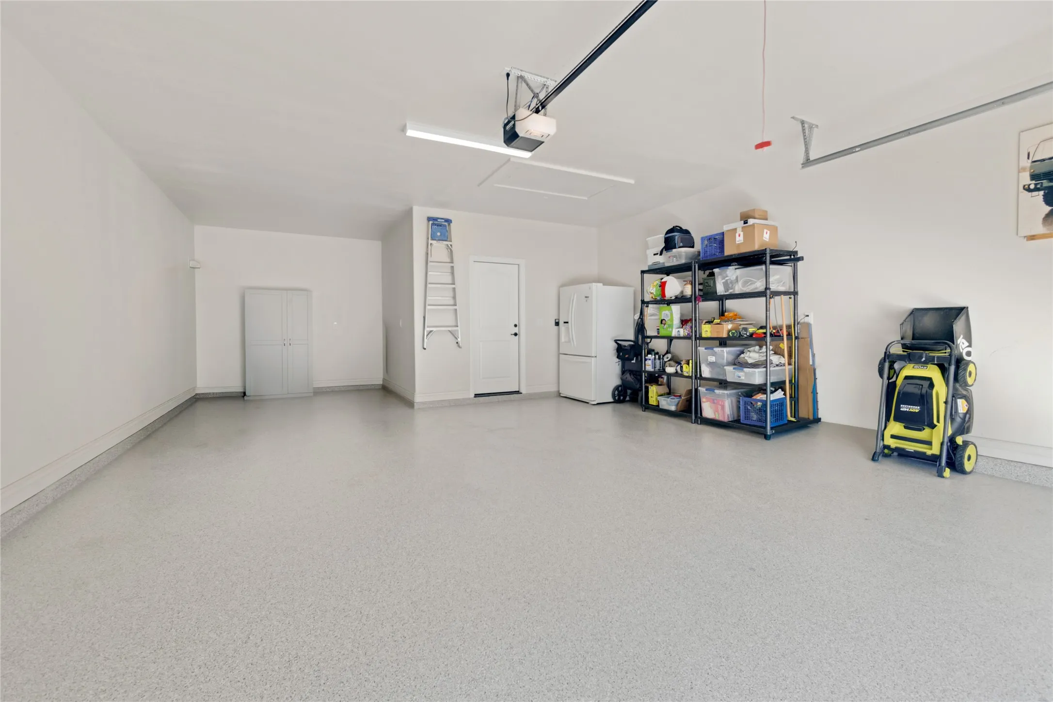 Oversized garage large enough for two vehicles and a golf cart.  Epoxy Flooring!