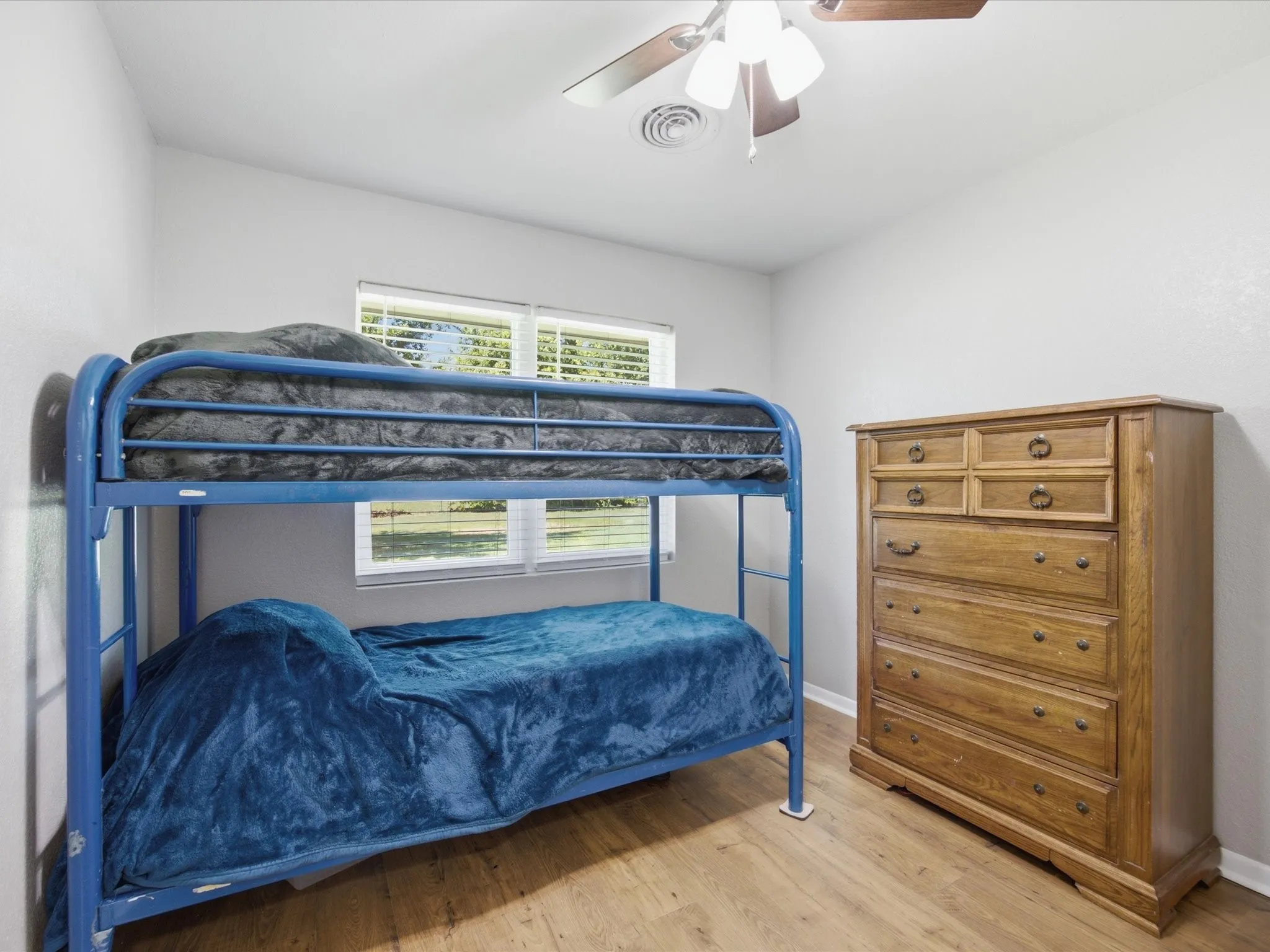 Bedroom 3 featuring an abundance of natural light, ceiling fan, and baseboards