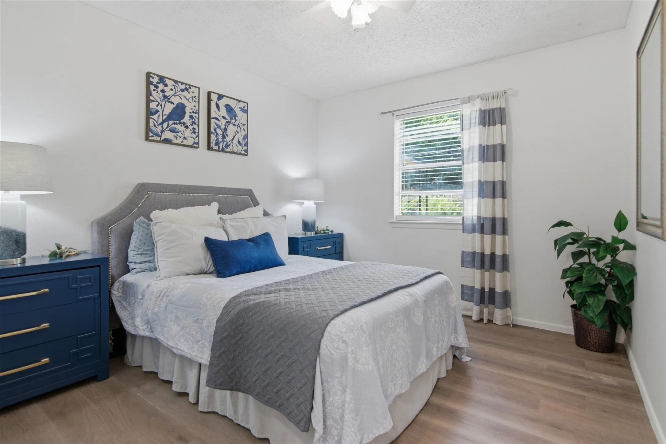 Light wood-finish flooring complements white walls