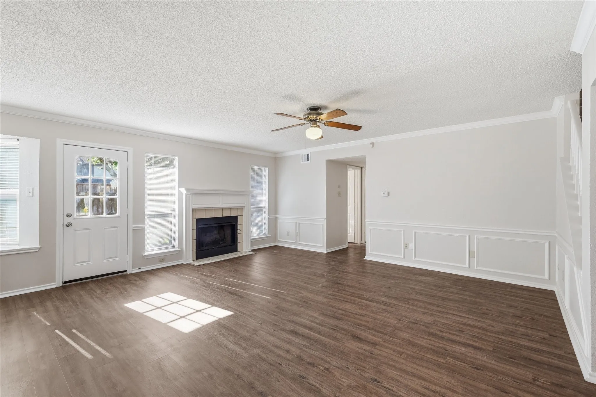 Spacious and inviting, the family room combines classic trim detail, rich flooring and an easy connection to the rest of the home.