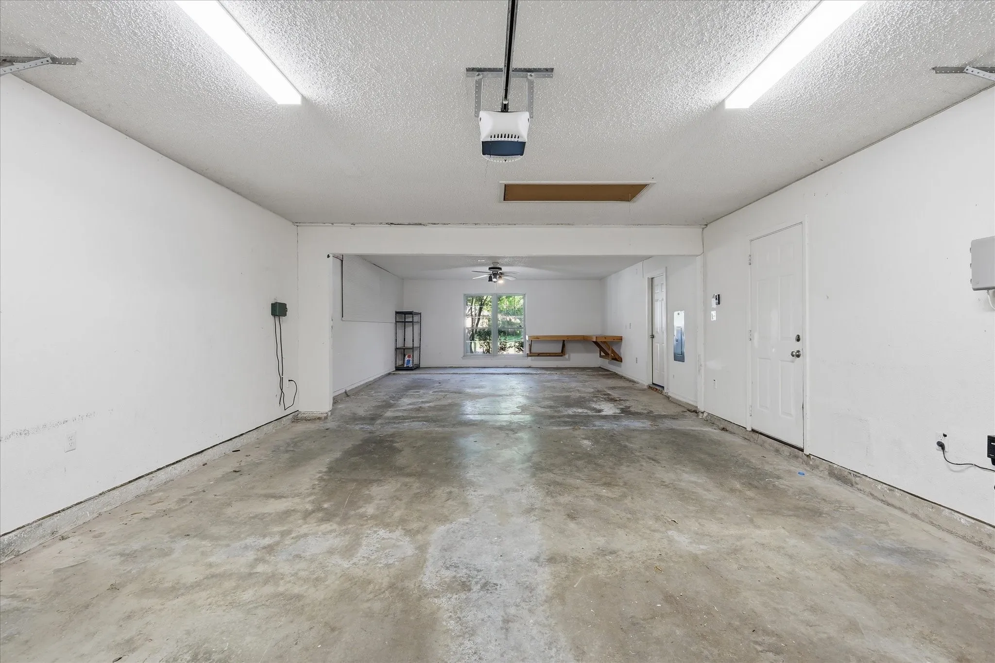 An exceptionally deep 4 car garage provides abundant room for vehicles, storage, hobbies or a dedicated workshop area.
