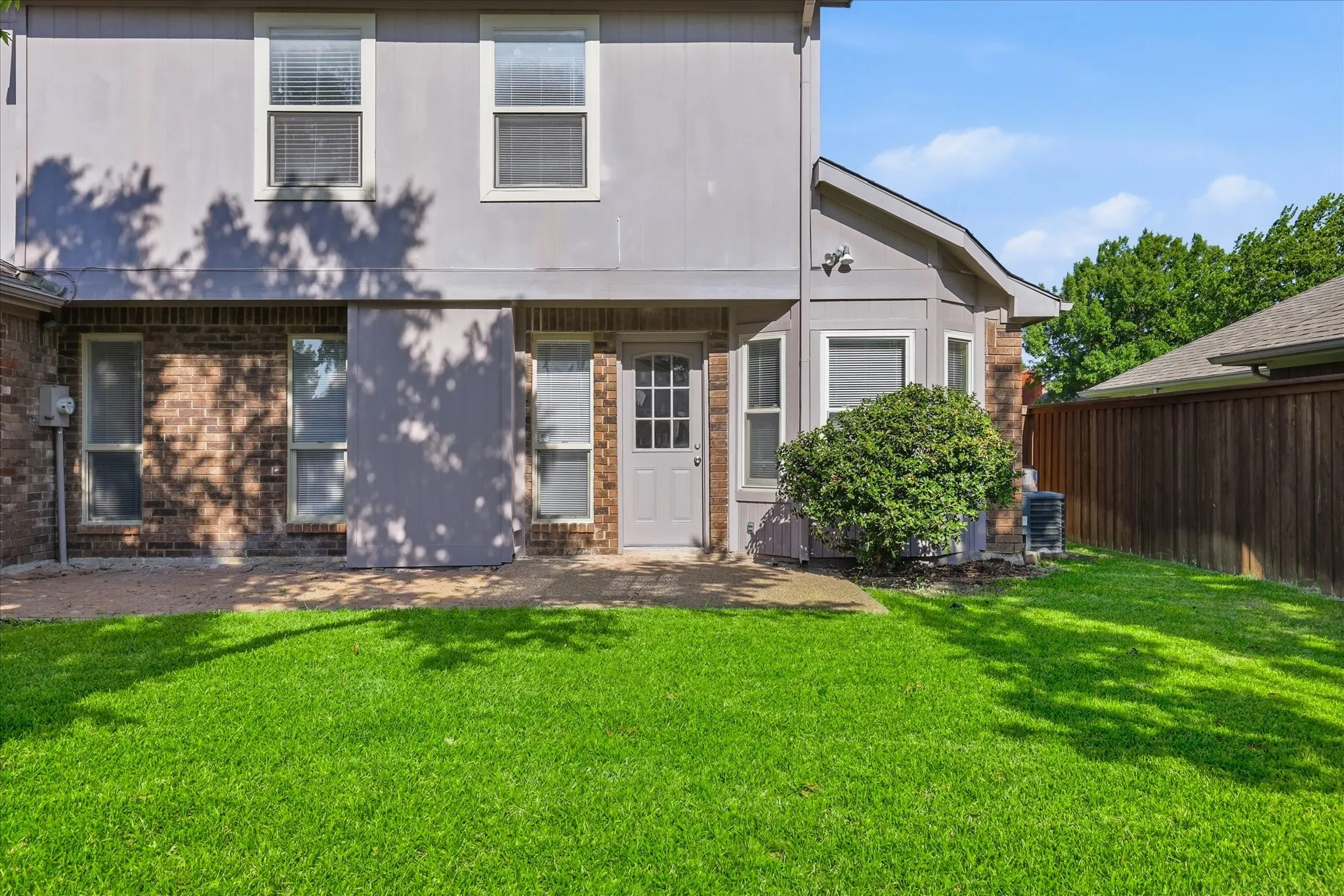 A convenient rear patio creates an easy transition from indoor living to outdoor relaxation and weekend gatherings.
