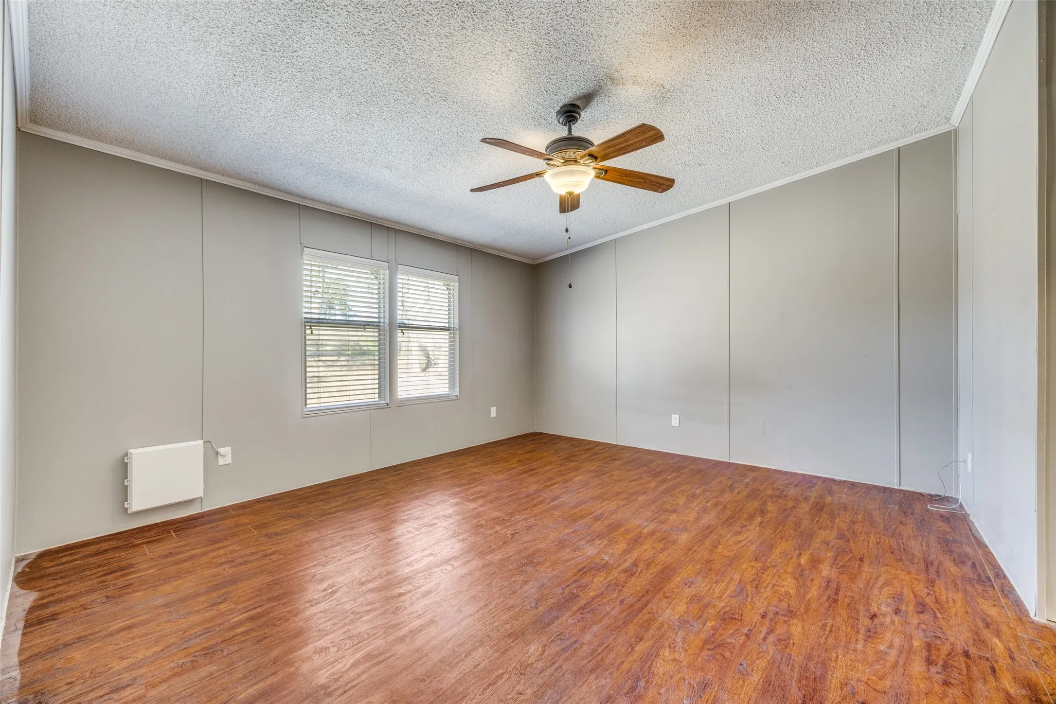 Nice size primary bedroom with ceiling fan and LVP flooring