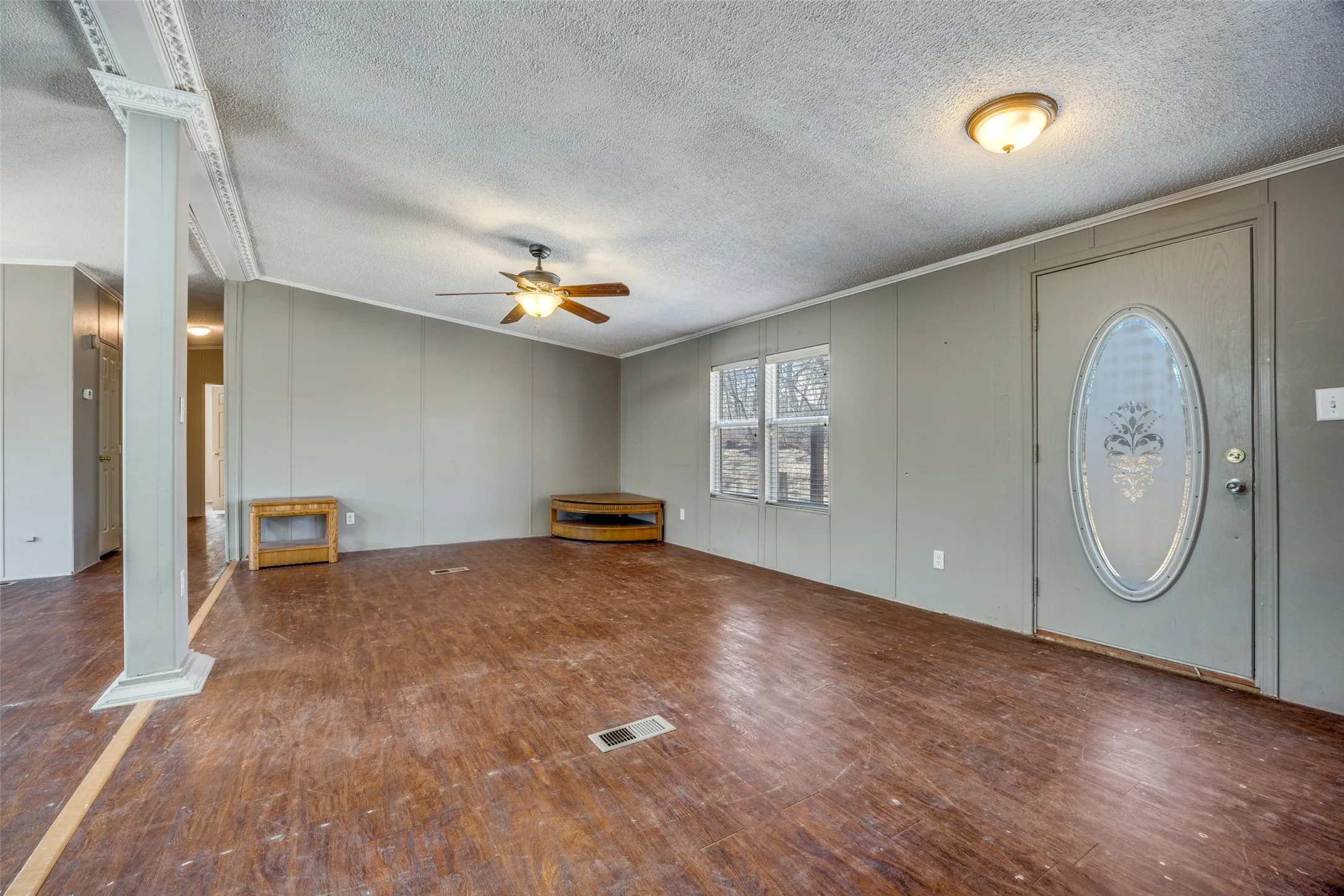 Front door opens to large living space/kitchen area