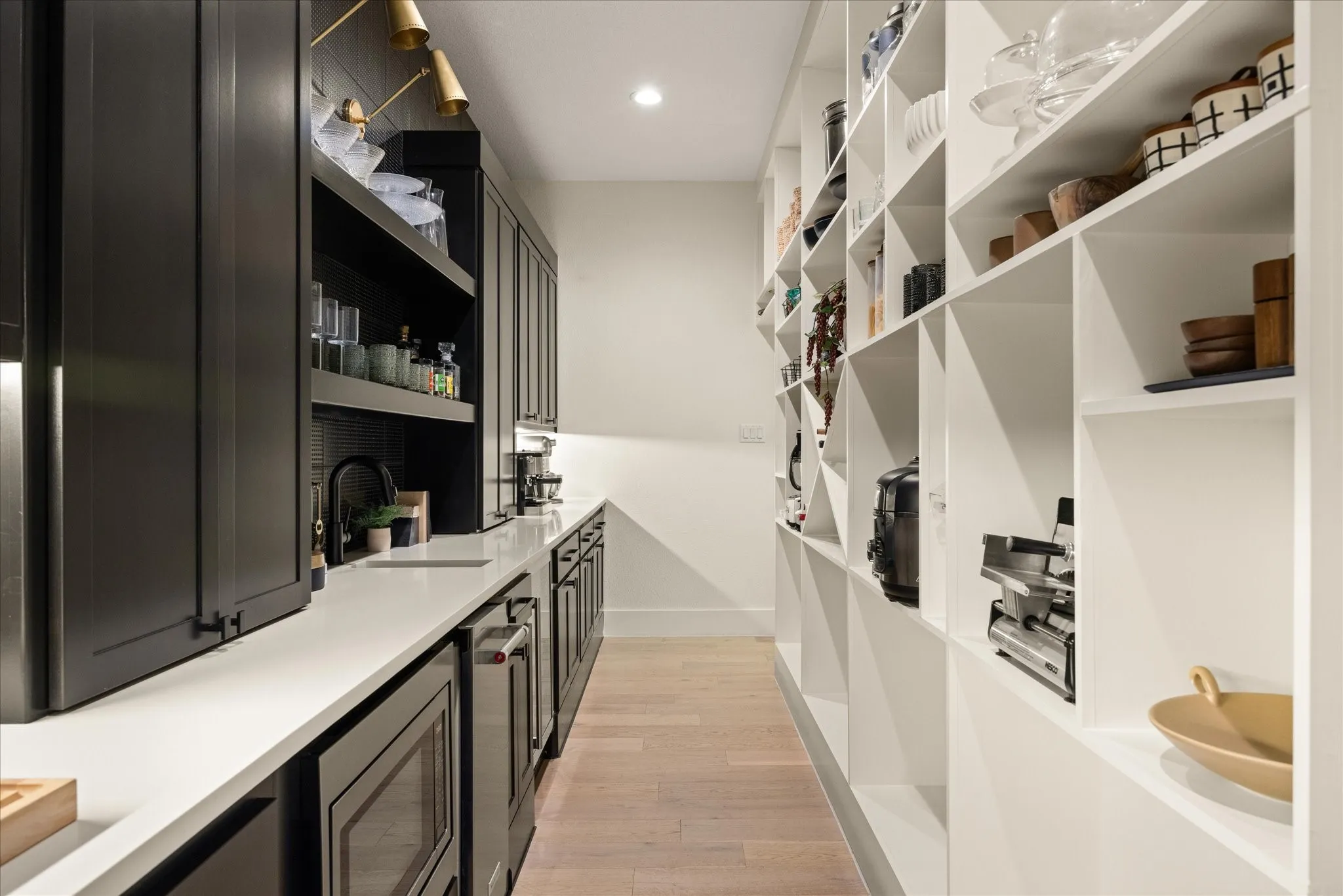 Amazing pantry with two disguised entries and lots of electrical outlets