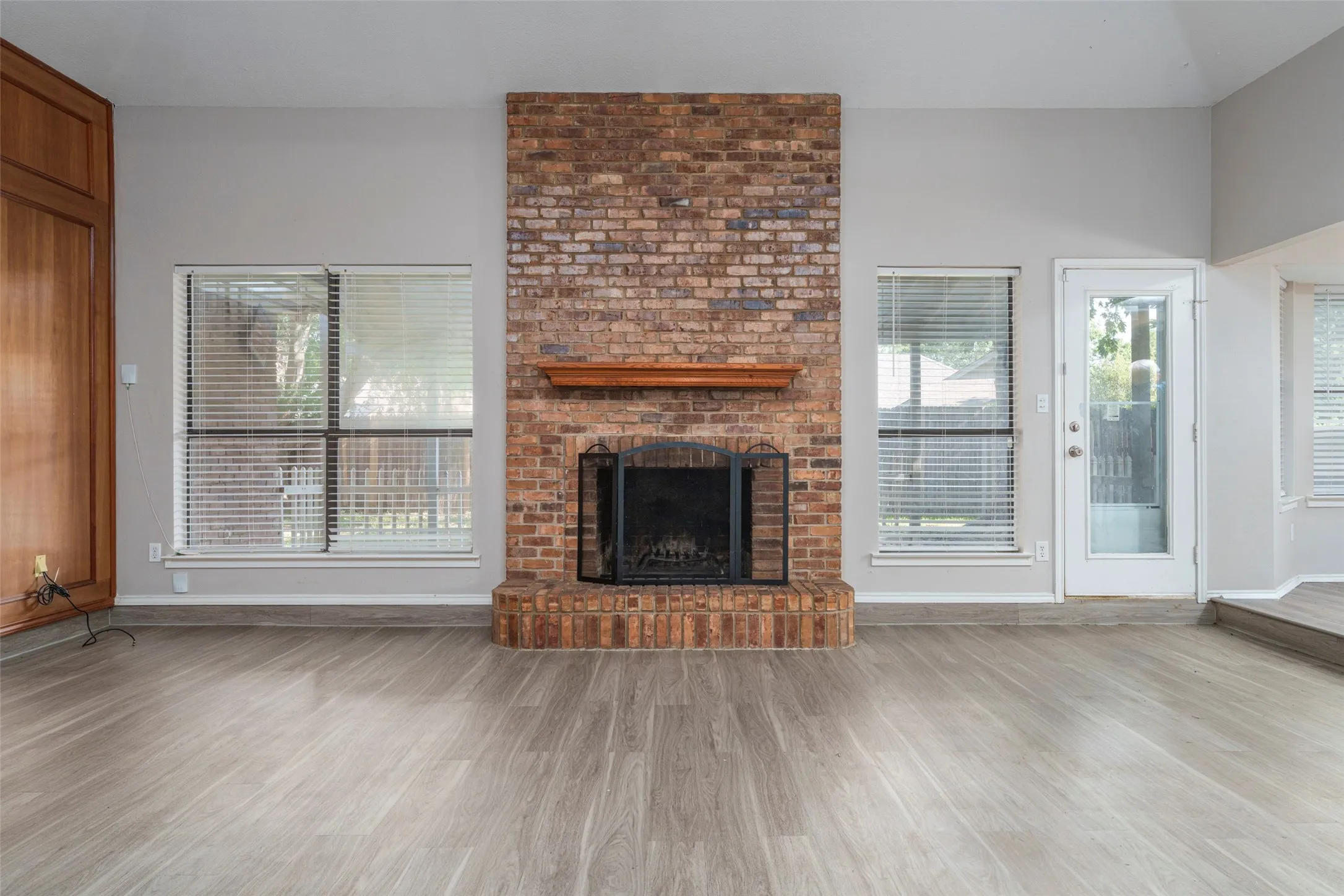 Huge family room with vaulted ceilings and wood-burning fireplace