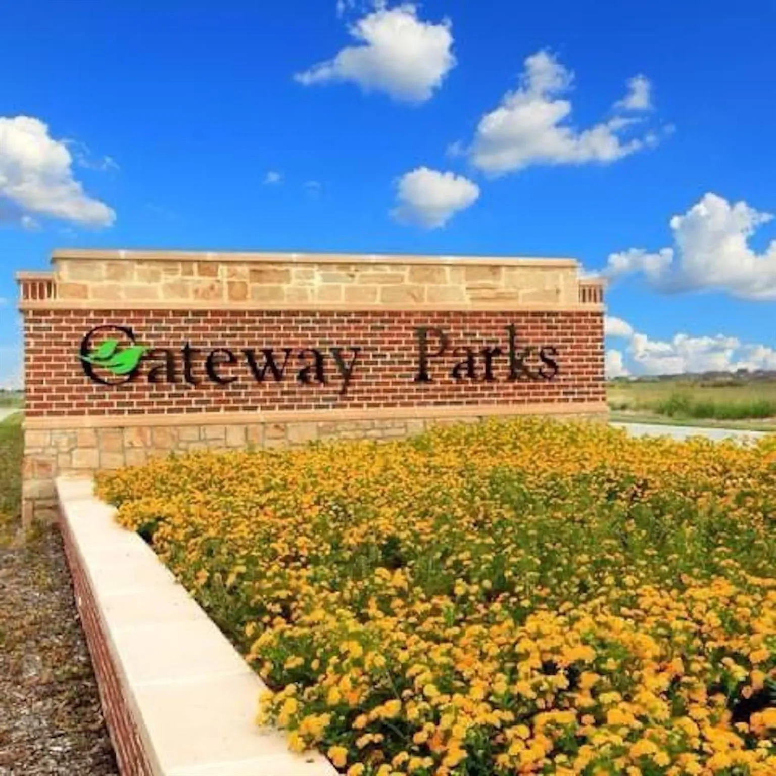 Gateway Parks community entrance sign featuring a brick and stone facade