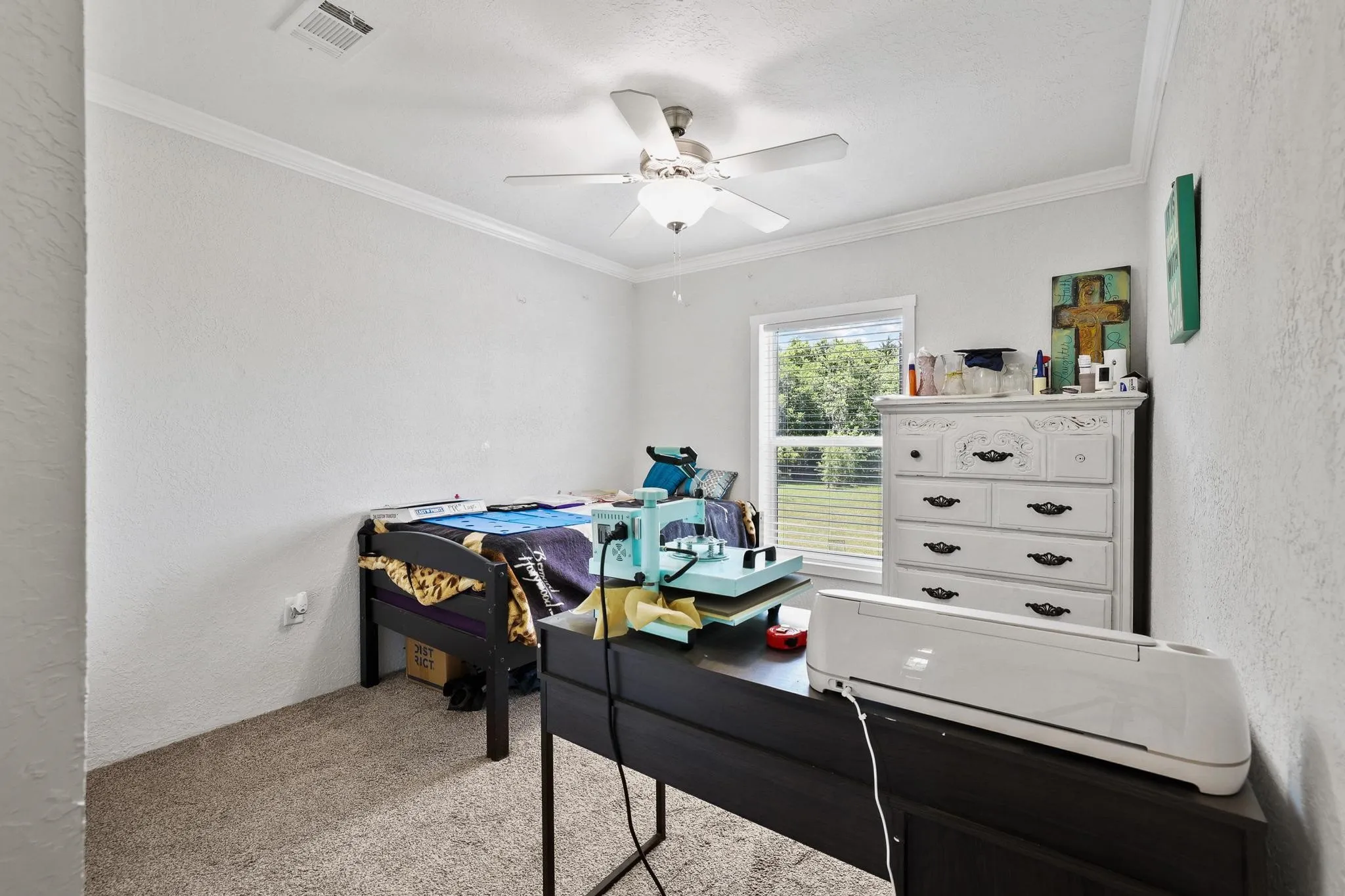 Room featuring light-colored walls and neutral carpet flooring