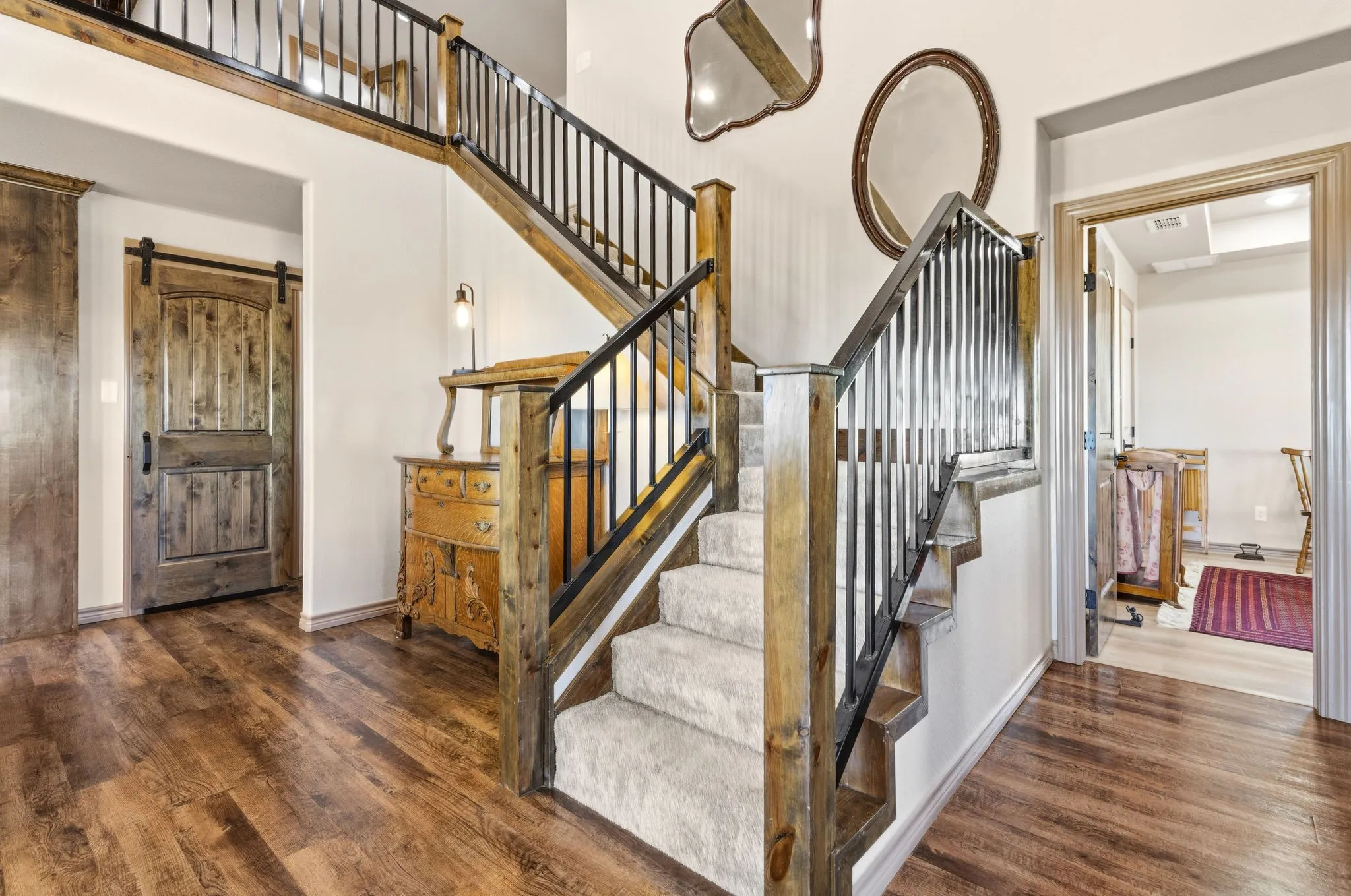 Go up the stairs and you will see the spacious loft with a full bathroom. Go to the right of the stairs and you will go to the guest bedroom with large walk in closet. Go to the left of the stairs and behind the sliding barn door is the walkin panty with electrical outlets for your electrical appliances.