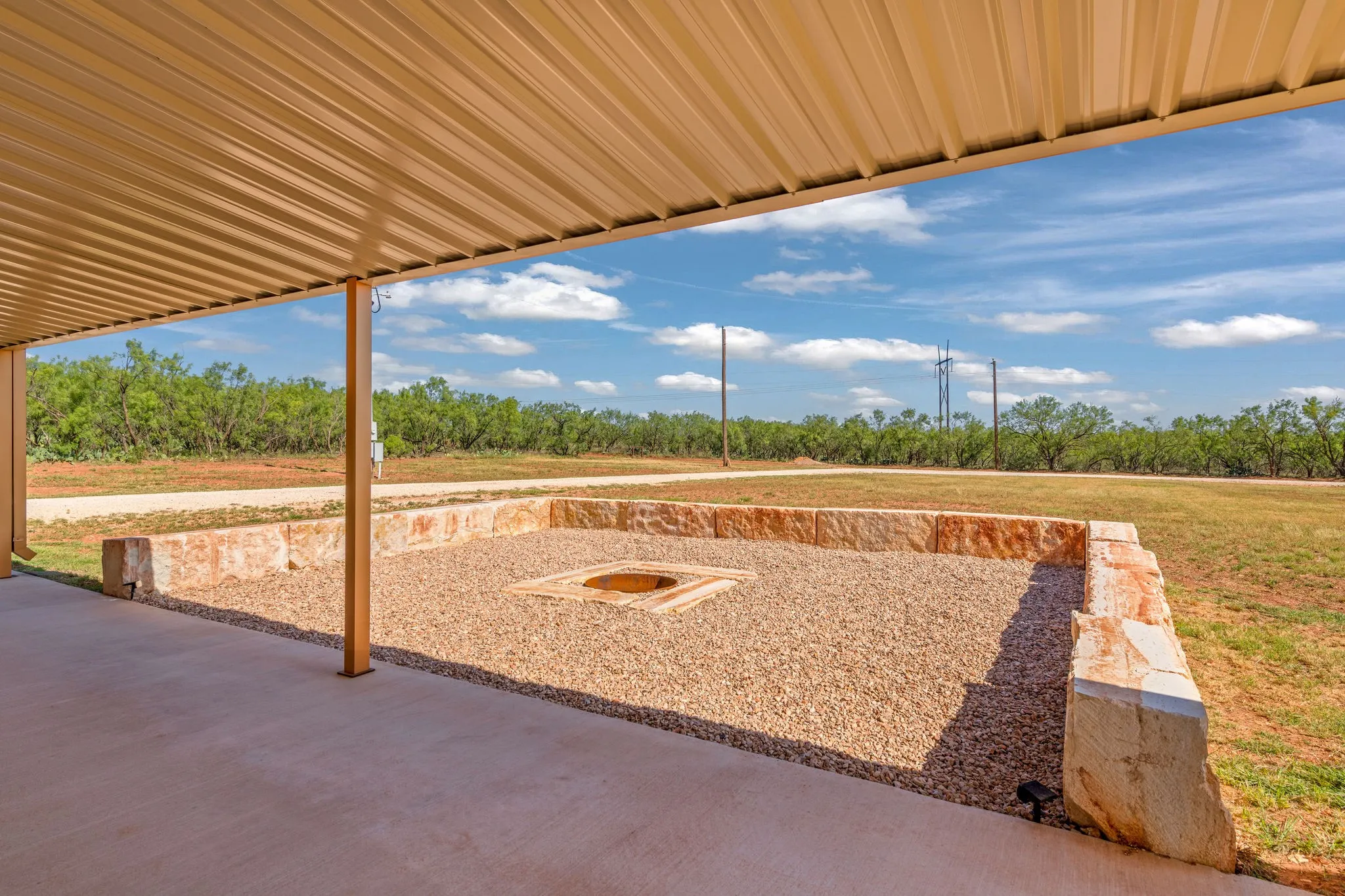 Fire pit  in the center with limestone blocks for sitting