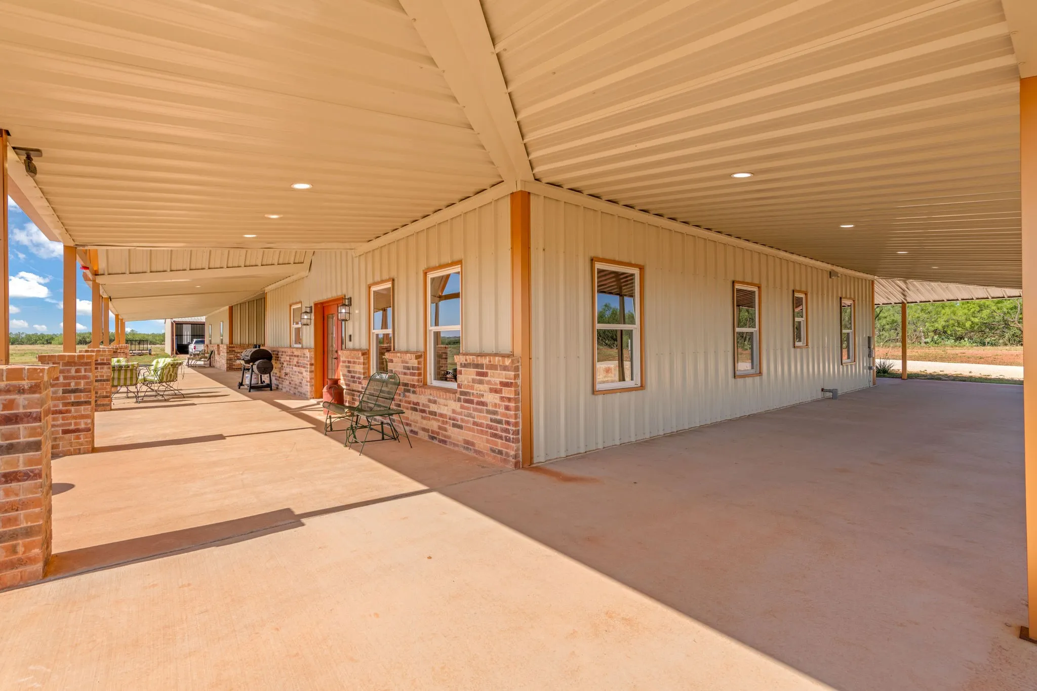 View of front porch with side view captured all under the roof line of a wrap around porch.