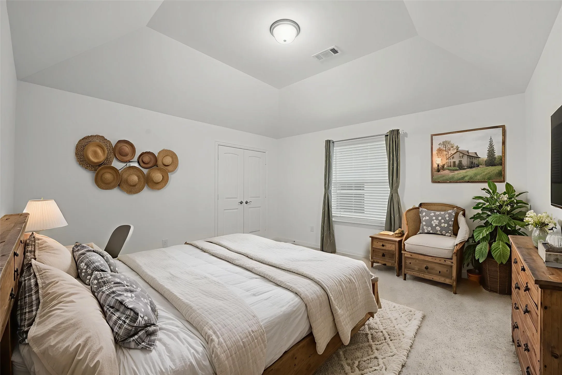 Tray ceiling featuring a central flush-mount light fixture