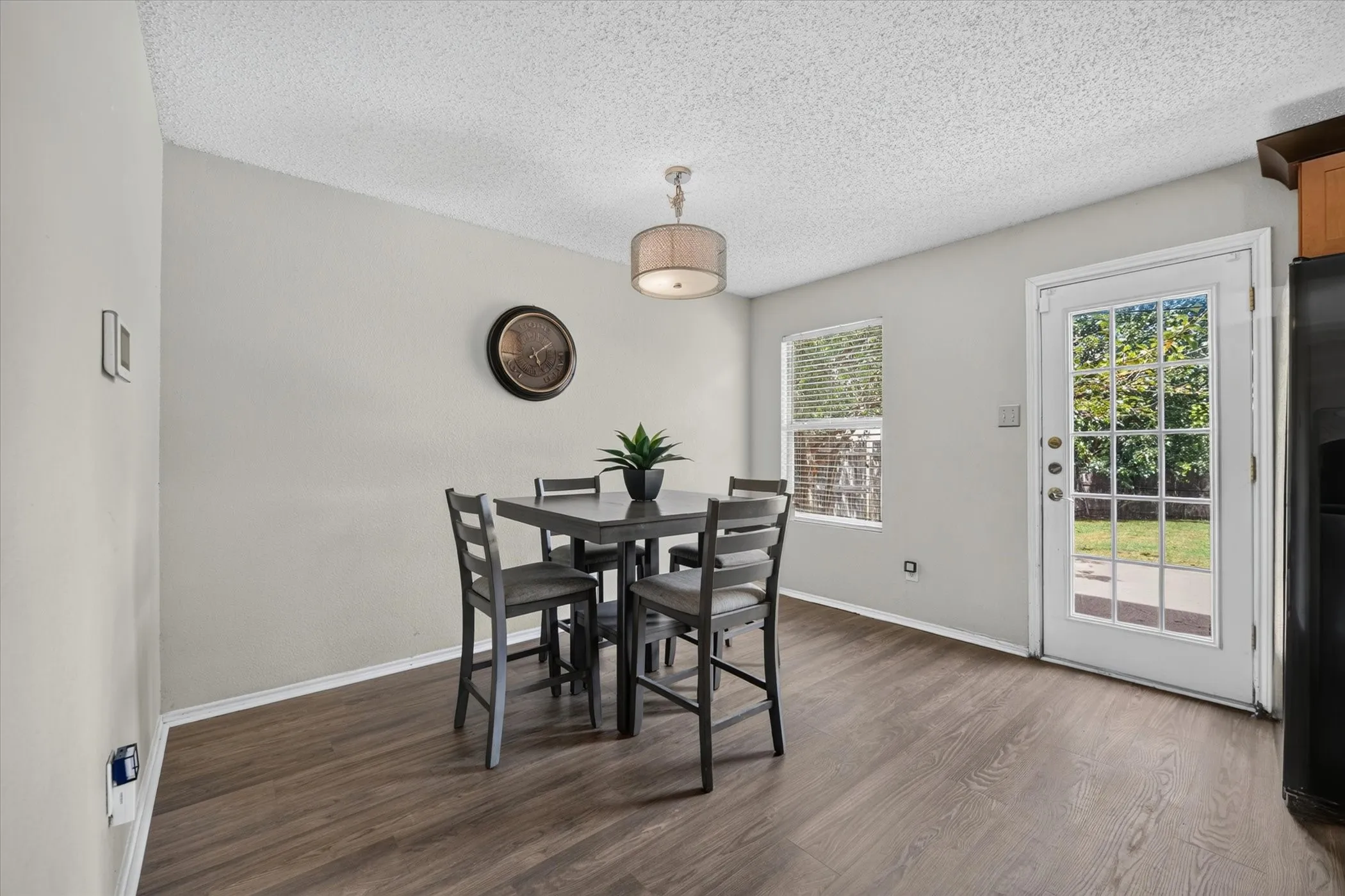 Dining area featuring wood-finish flooring and neutral wall tones