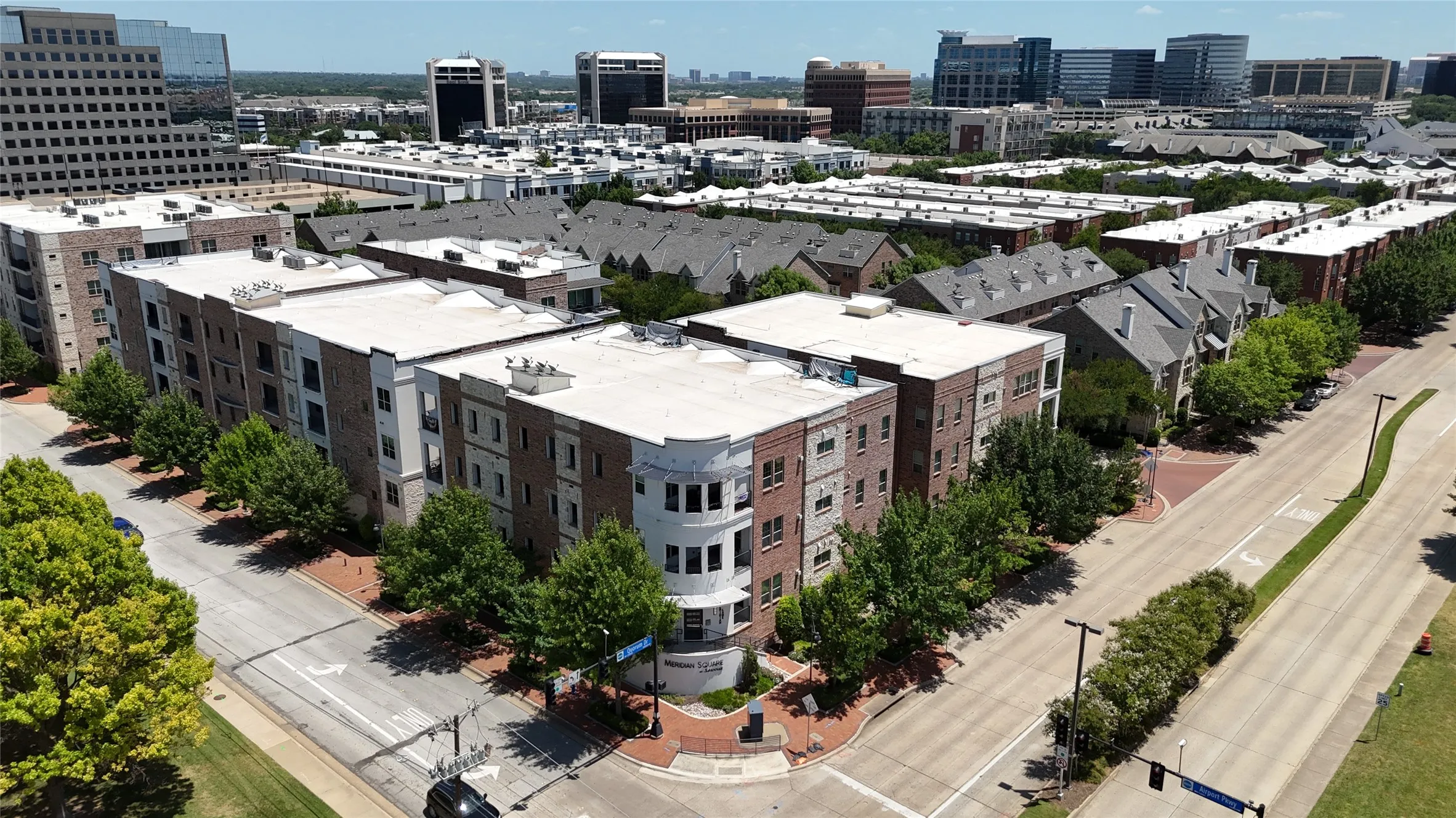 Multi-story residential buildings with varied facades including brick, stone, and stucco finishes