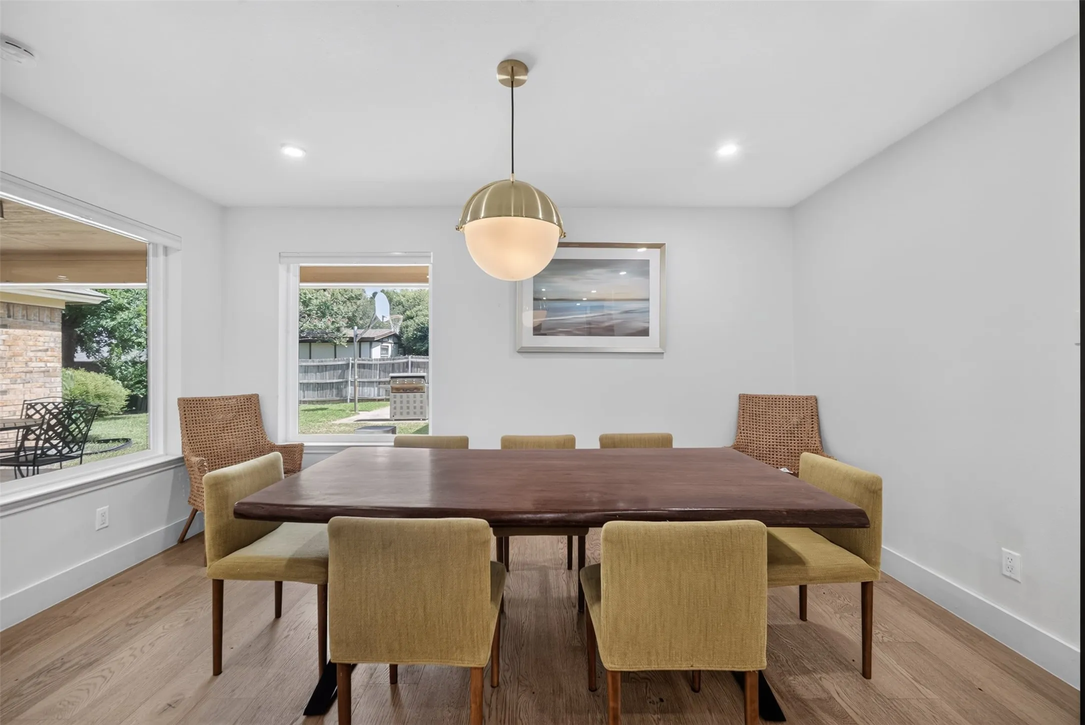 Bright interior space featuring light wood-finish flooring, white walls, and recessed lighting