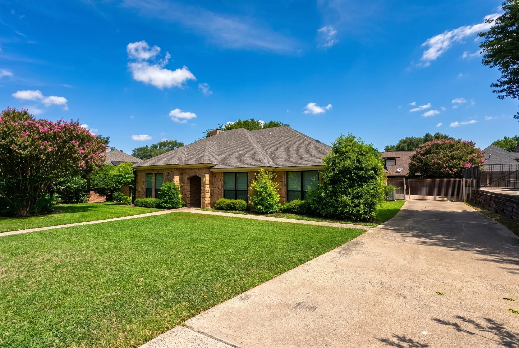 Stone exterior residence with a composition shingle roof