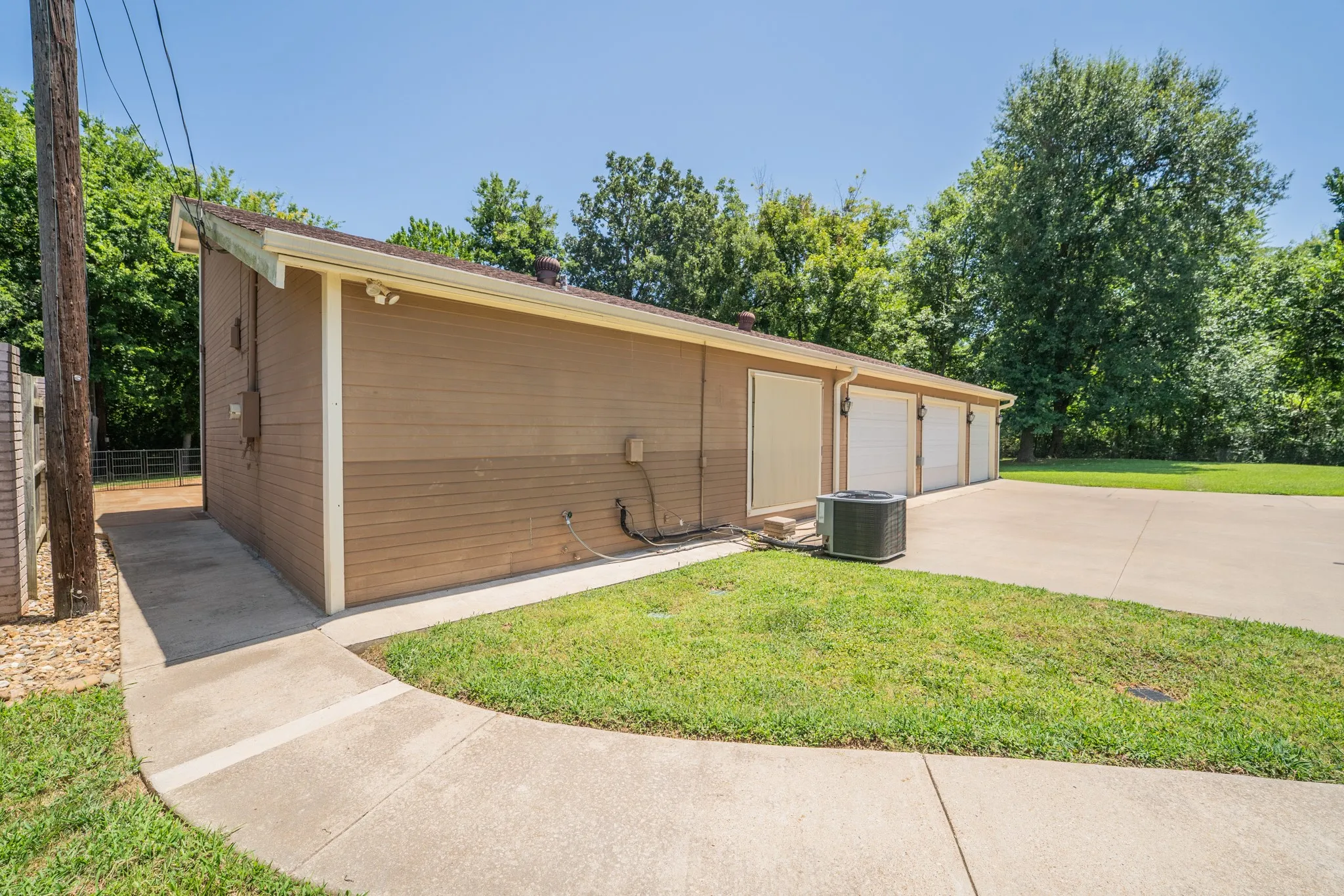 3 car garage and bedroom window.