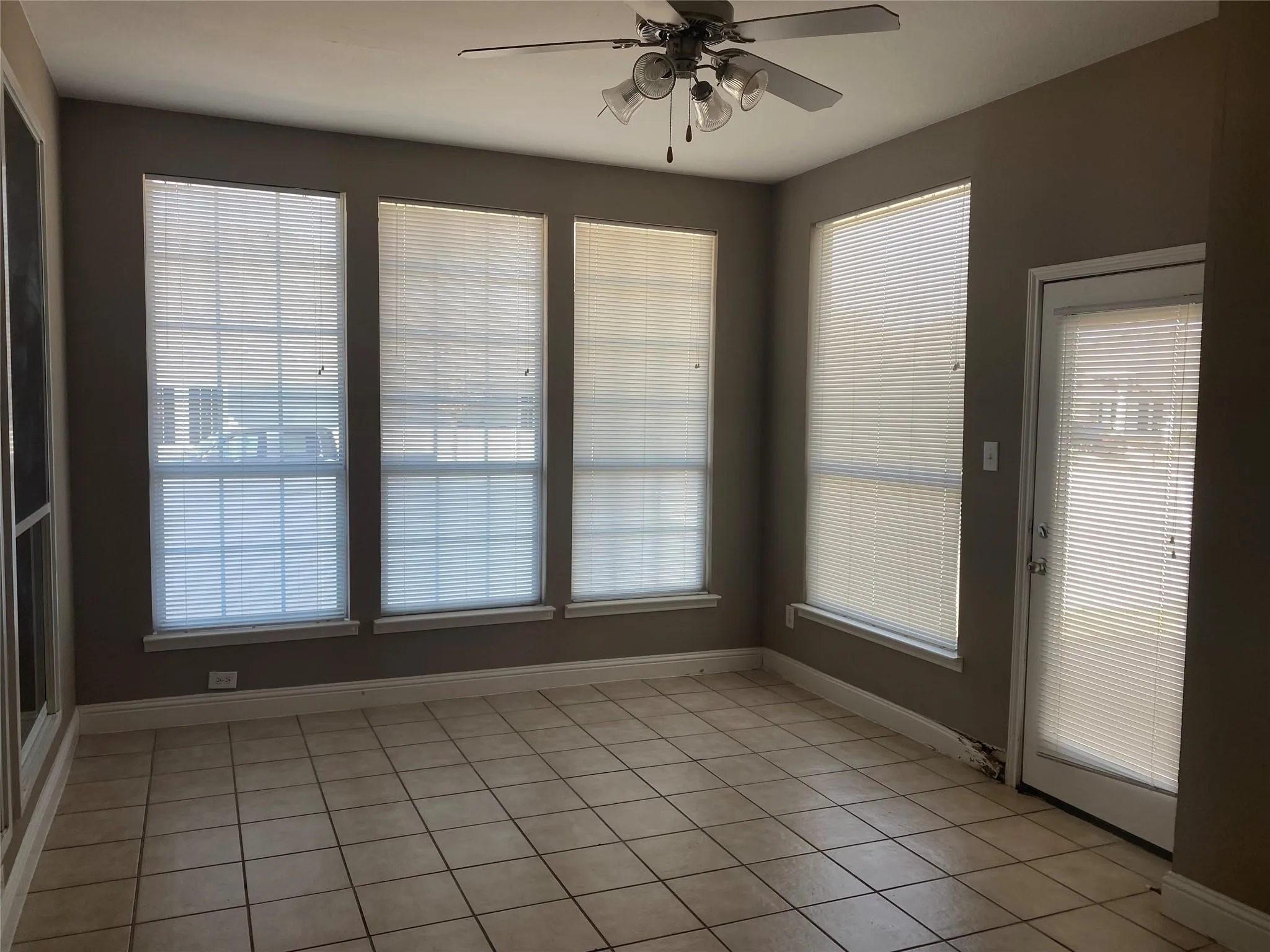 Unfurnished sunroom with plenty of natural light