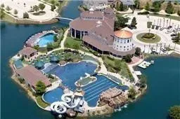 Aerial overview of property's location featuring a large body of water