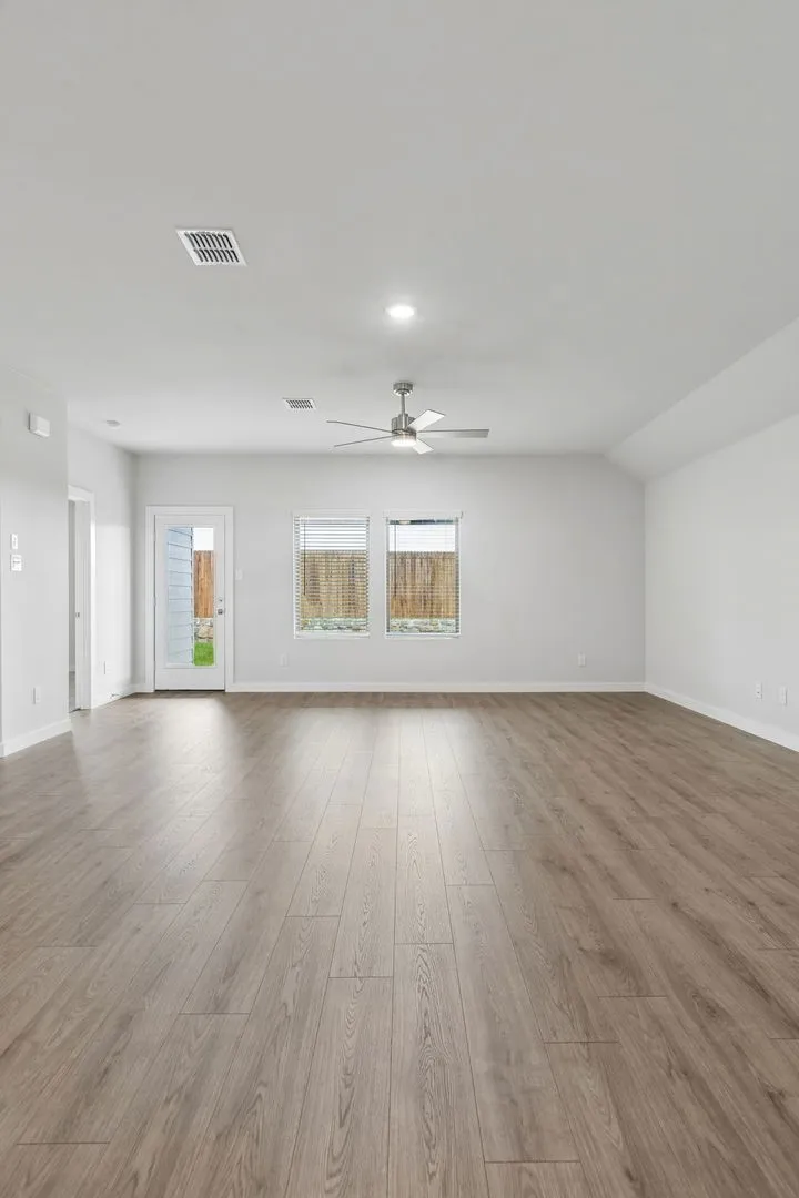 Living Room in the Oscar home plan by Trophy Signature Homes – REPRESENTATIVE PHOTO