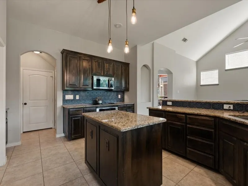 Natural wooden cabinets and island