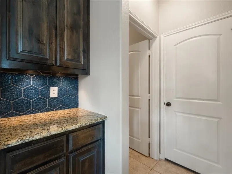 Leads to laundry and guest bathroom downstairs for convience