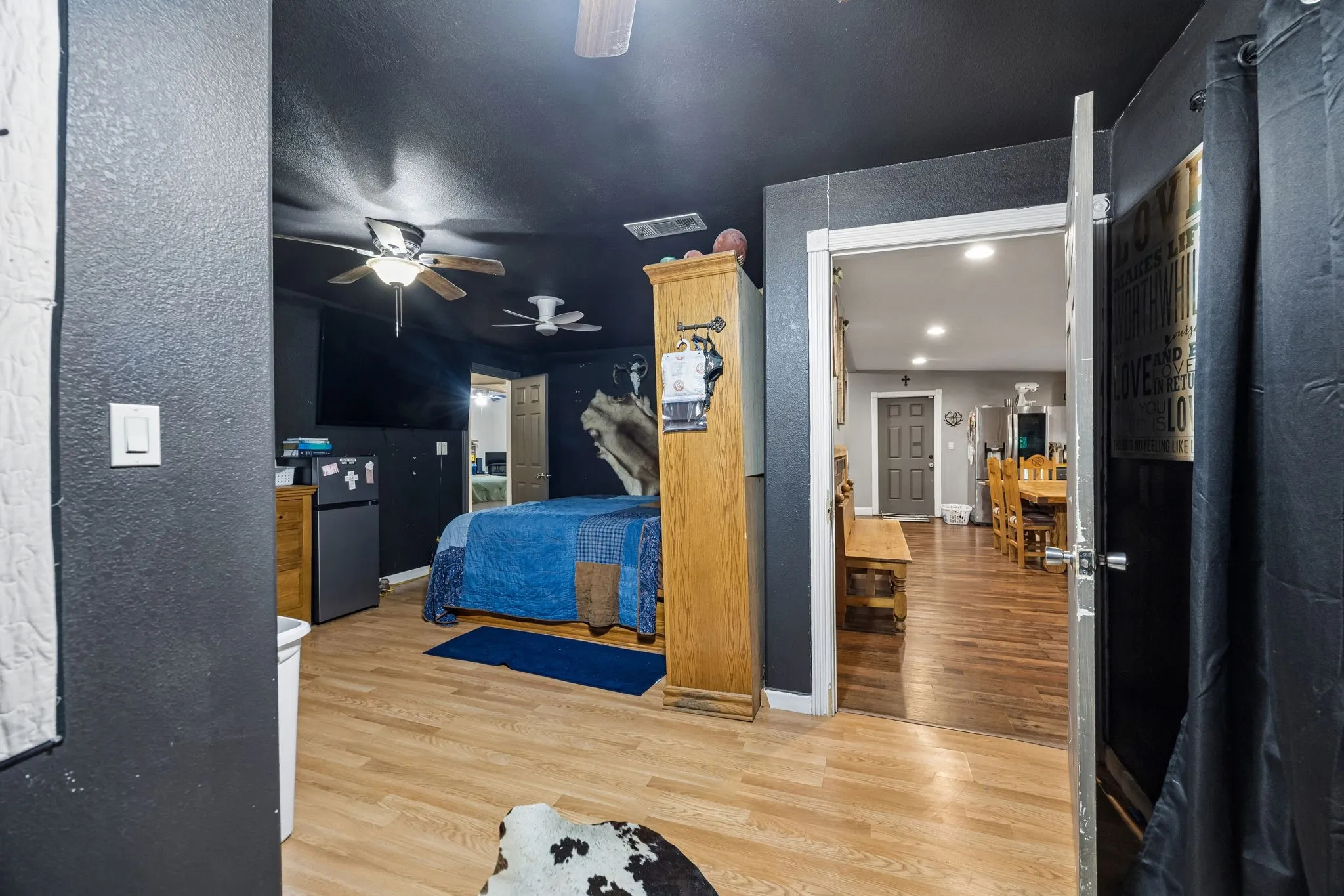 Interior room featuring wood-finish flooring