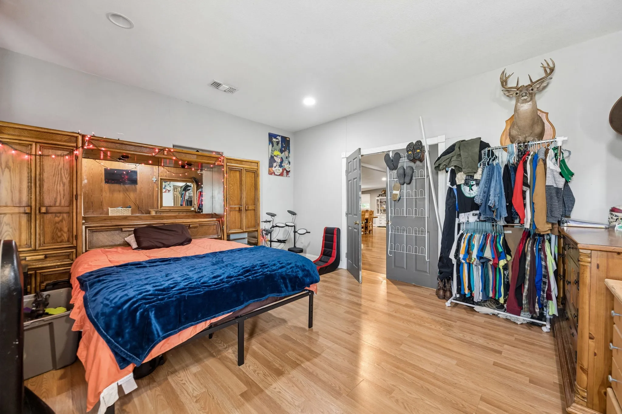 Bedroom featuring wood-finish flooring, light gray wall paint, and recessed ceiling lighting