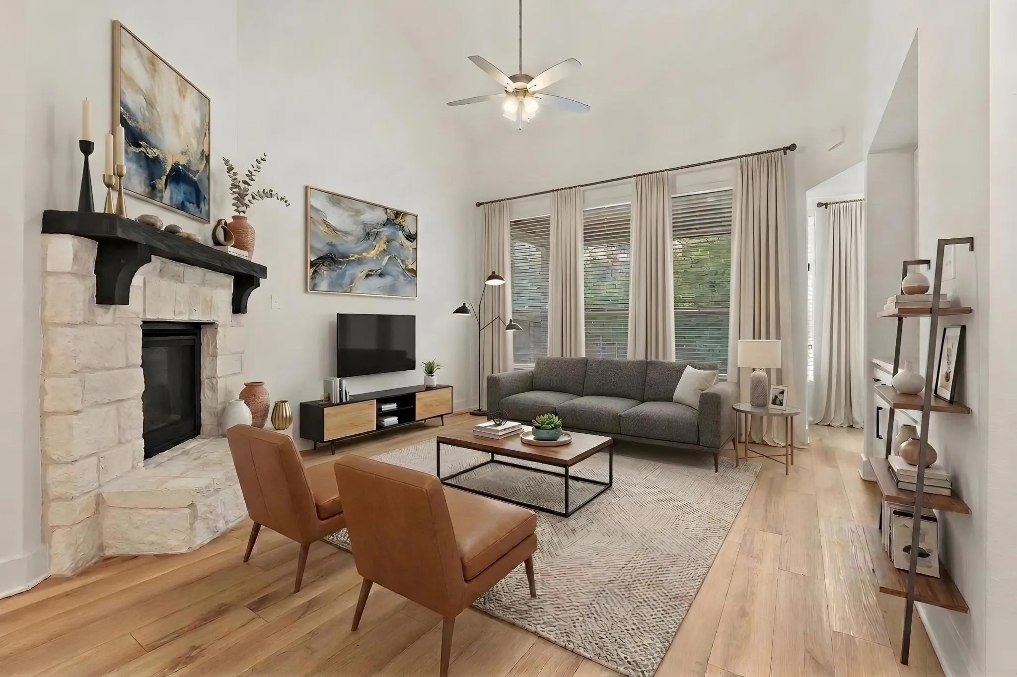 Virtually staged living room with Austin stone gas fireplace and built-ins.