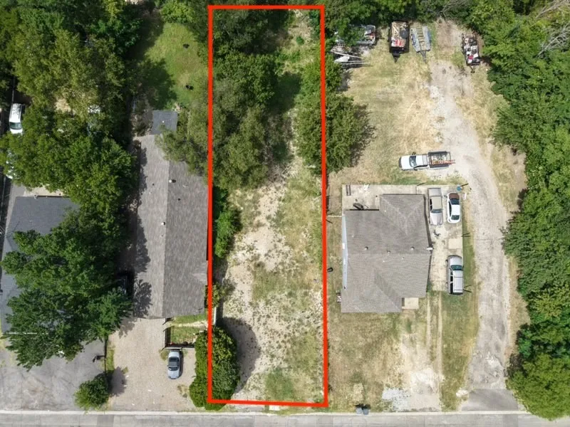 Expansive undeveloped land parcel with mature trees and ample open space