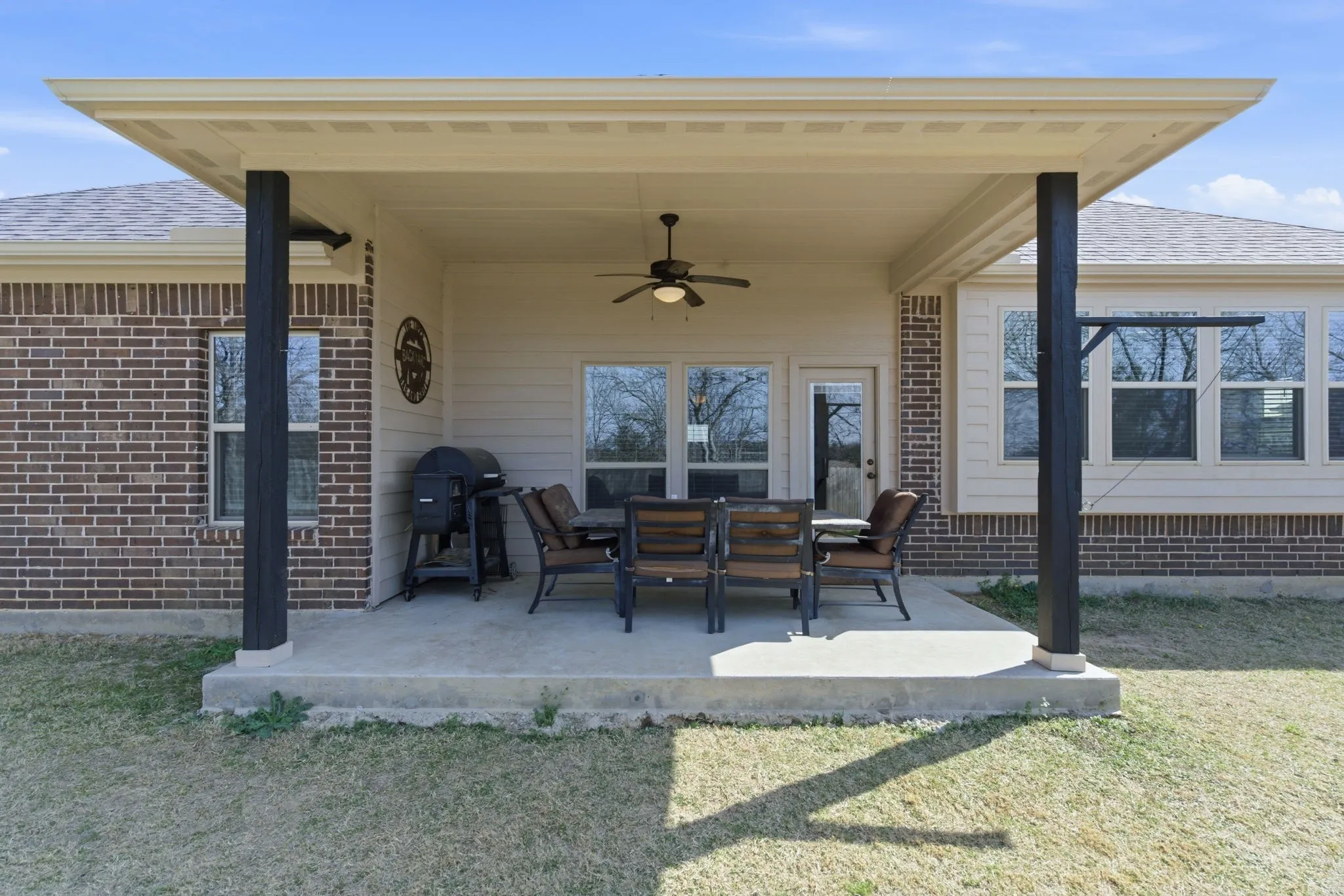 View of patio / terrace with ceiling fan and a grill