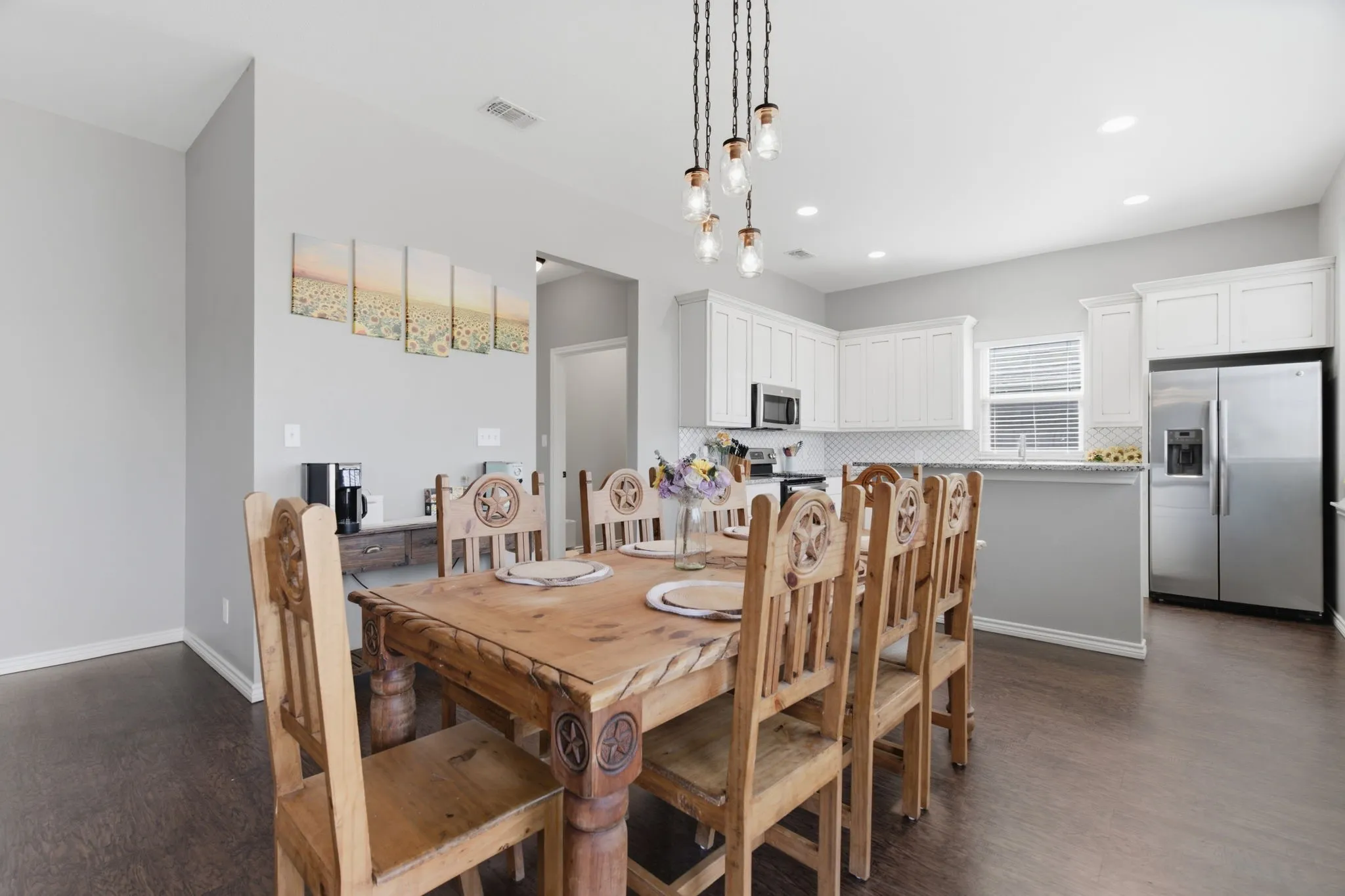 Dining room featuring dark wood-type flooring and baseboards