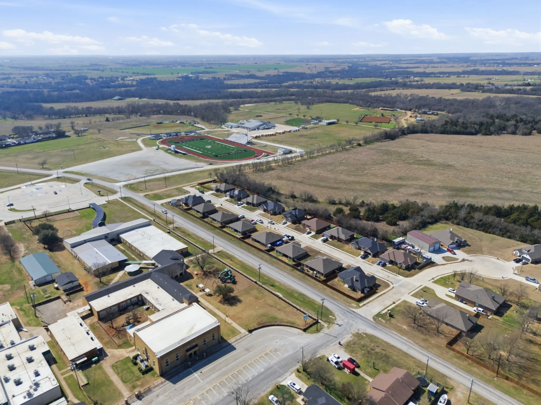 View of property location with nearby suburban area